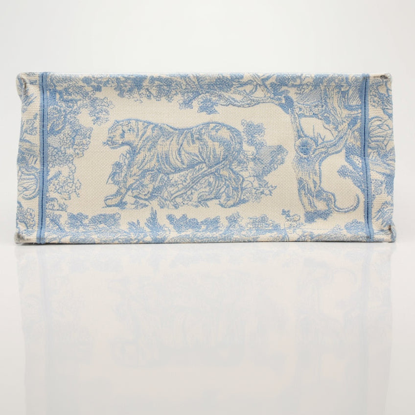 Christian Dior Book Tote handbag with elegant design, featuring the iconic Dior pattern and gold accents.
