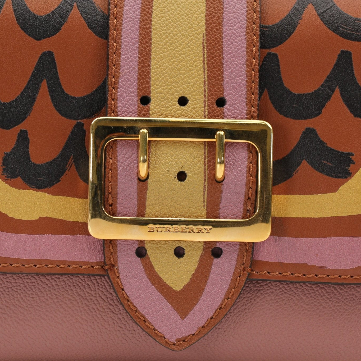 Gold & Beyond Burberry Buckle Crossbody Bag handbag with adjustable strap and signature check pattern, close-up view of buckle detail.