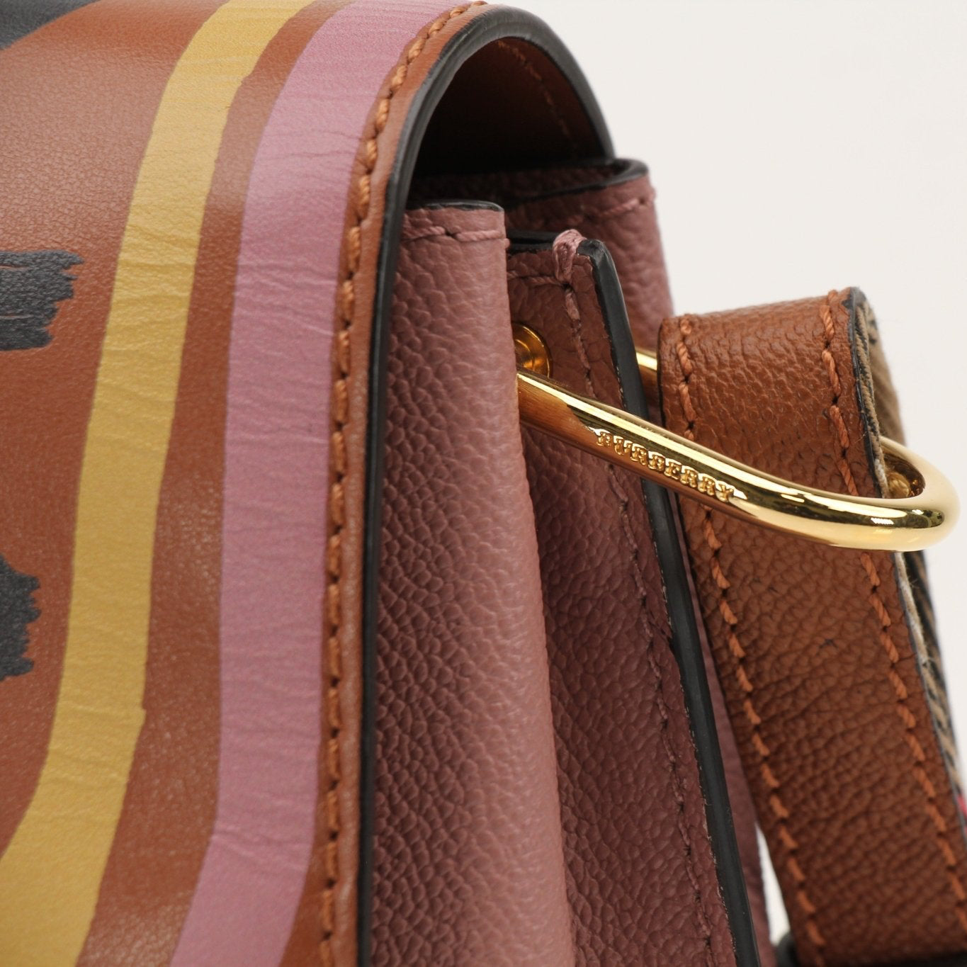 Gold & Beyond Burberry Buckle Crossbody Bag, stylish handbag with buckle detail, shown on a plain background.
