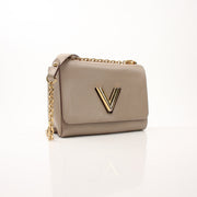 Louis Vuitton Beige Twist MM shoulder handbag with gold hardware, featuring a stylish design and structured shape.