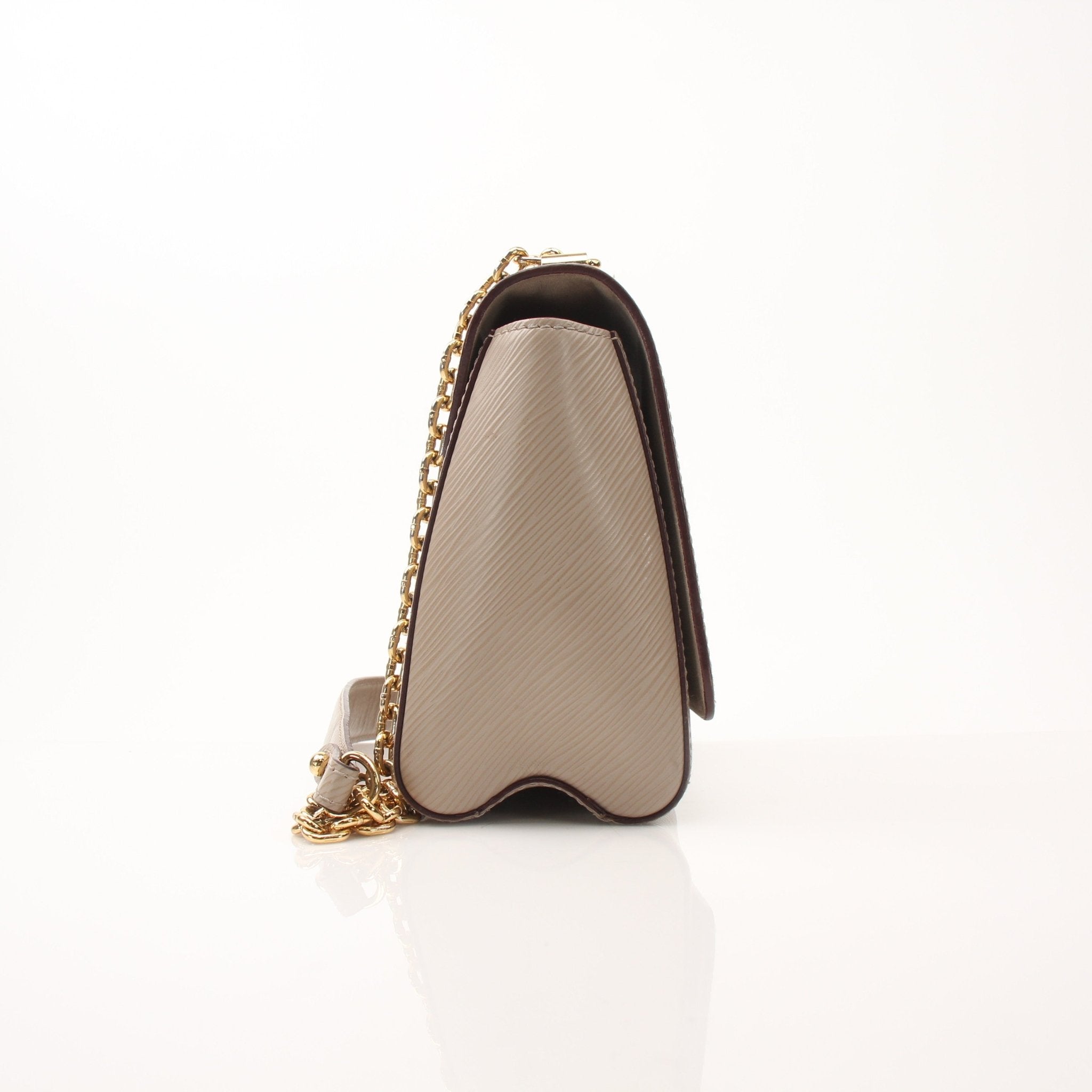 Louis Vuitton Beige Twist MM shoulder handbag with gold hardware and adjustable strap, stylish and elegant accessory.