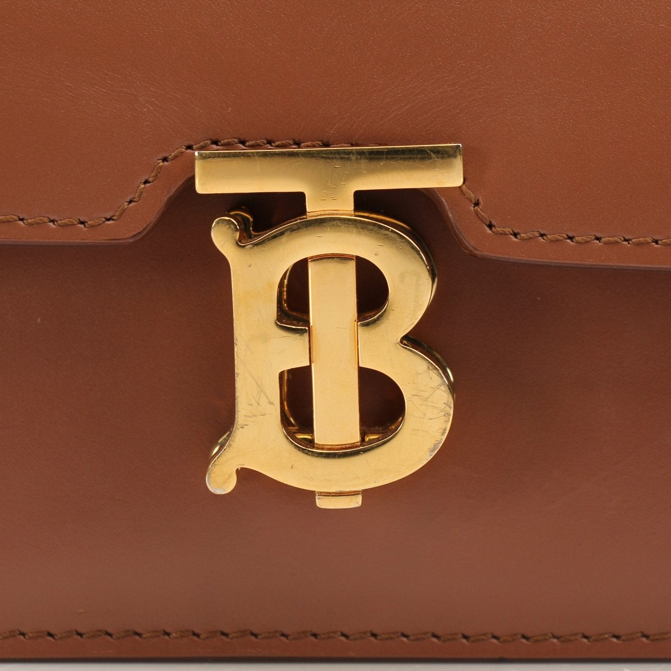 Gold & Beyond Burberry TB Bag handbag with adjustable strap and signature check pattern, stylish accessory for everyday wear.