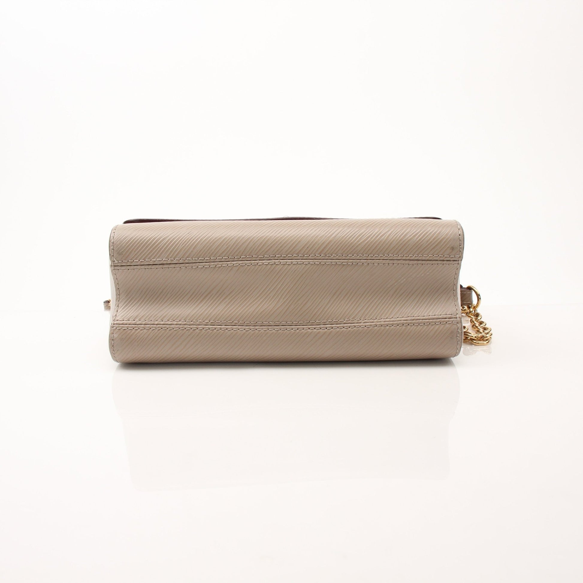 Louis Vuitton beige Twist MM shoulder handbag with gold hardware, featuring smooth leather and elegant design.