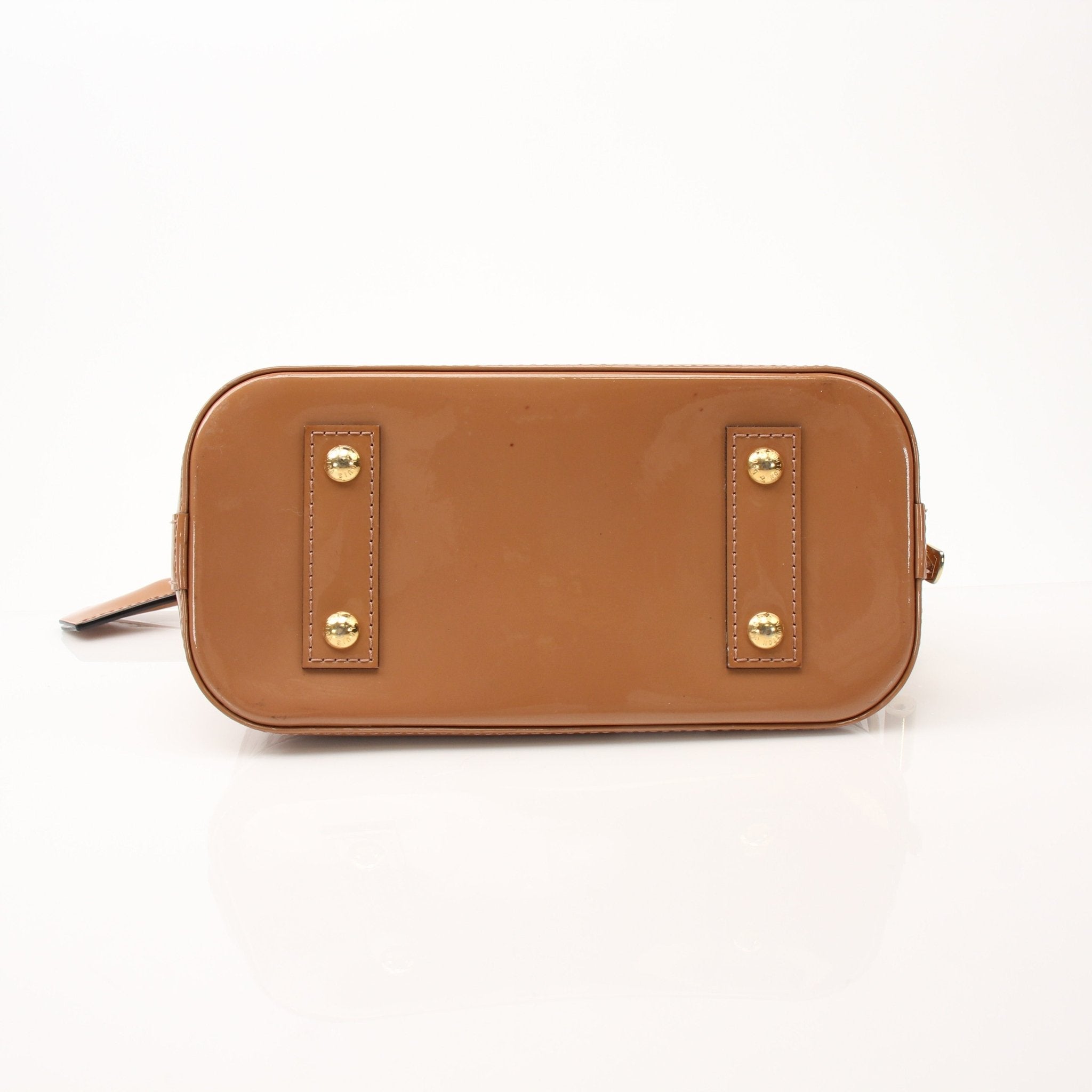 Louis Vuitton Rose Vernis Alma BB handbag in glossy pink leather with gold hardware, displayed on a neutral background.
