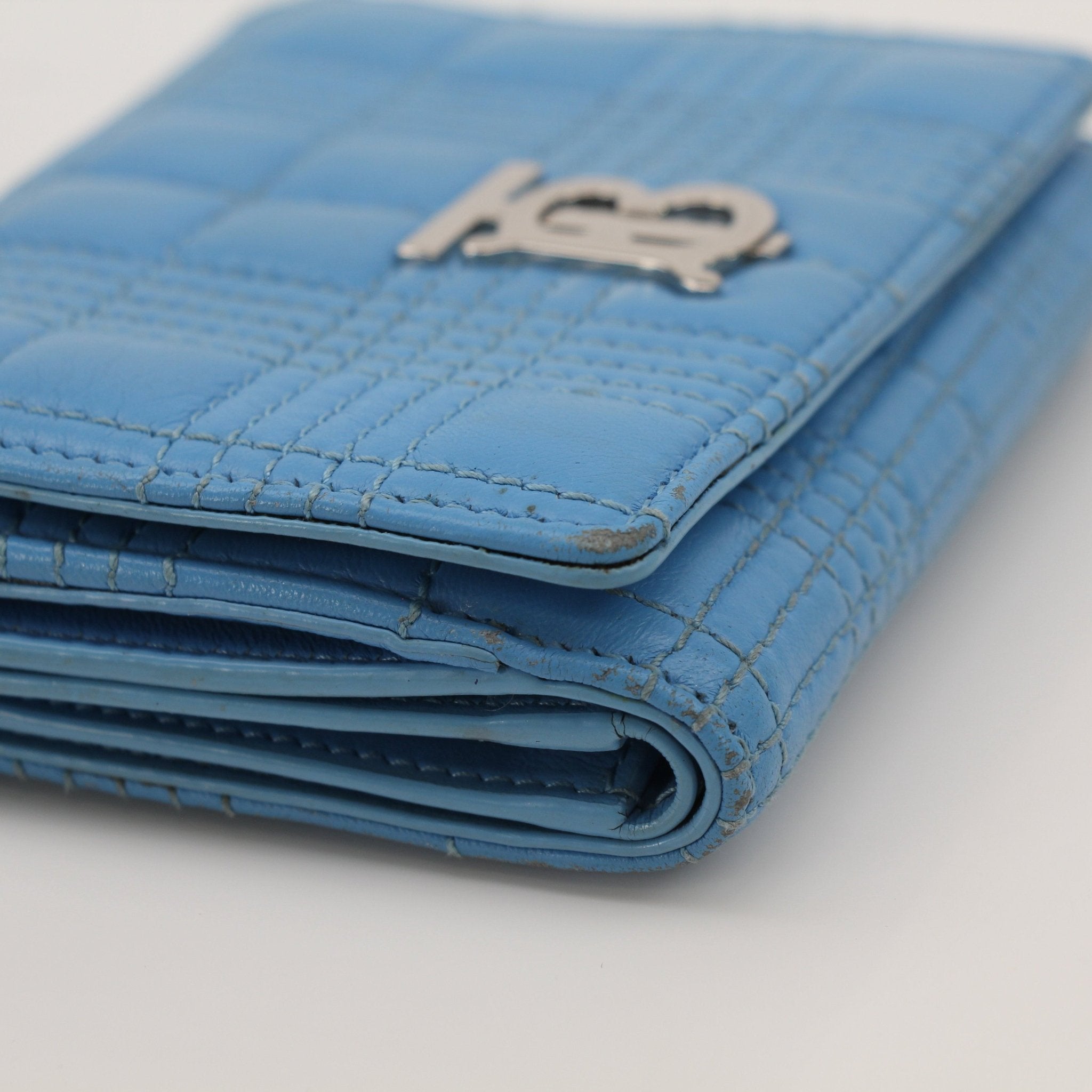 Gold & Beyond Burberry Lola Wallet showing black leather exterior, gold hardware, and multiple card slots.