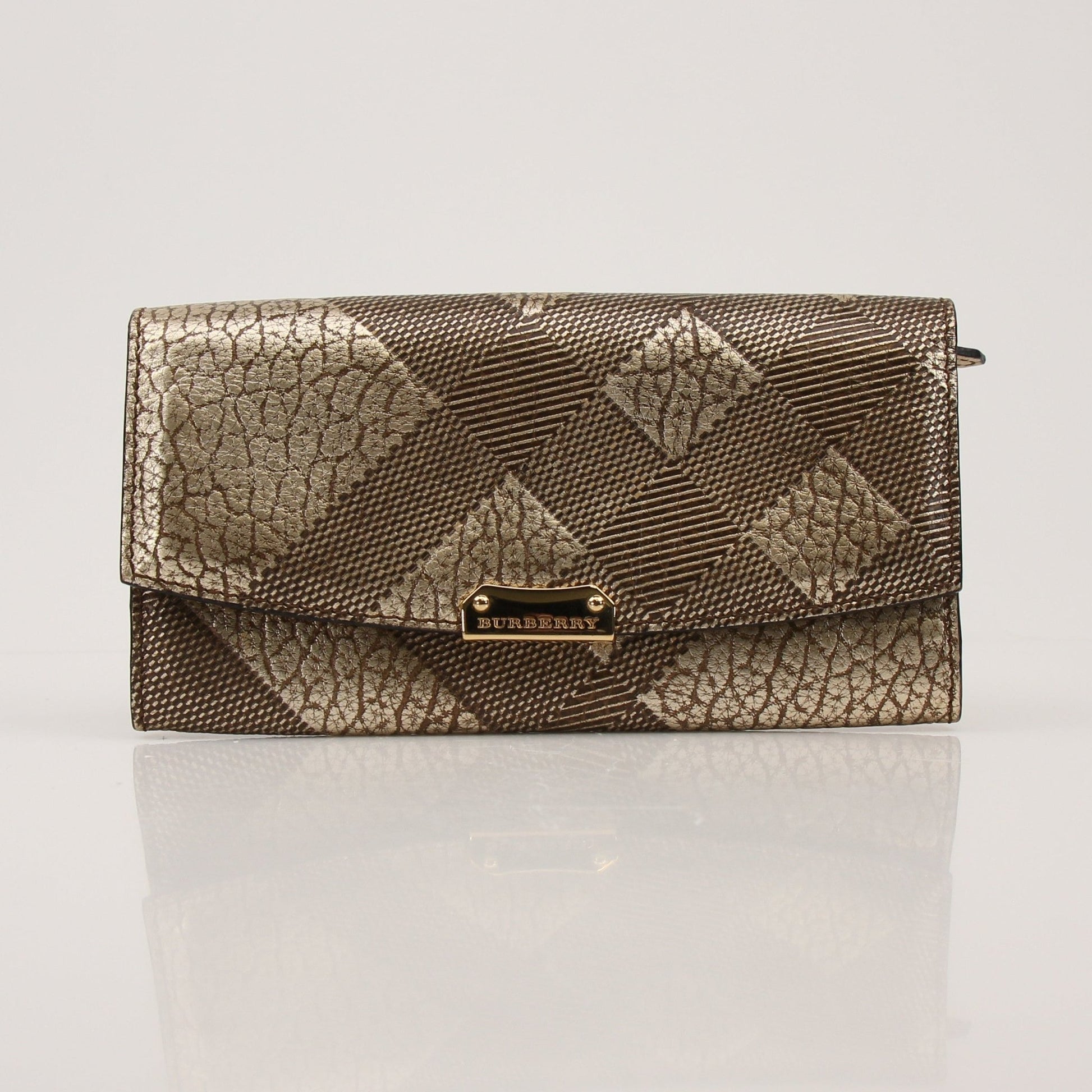 Gold & Beyond Burberry Continental Wallet showing brown leather exterior with multiple card slots and a gold logo emblem.