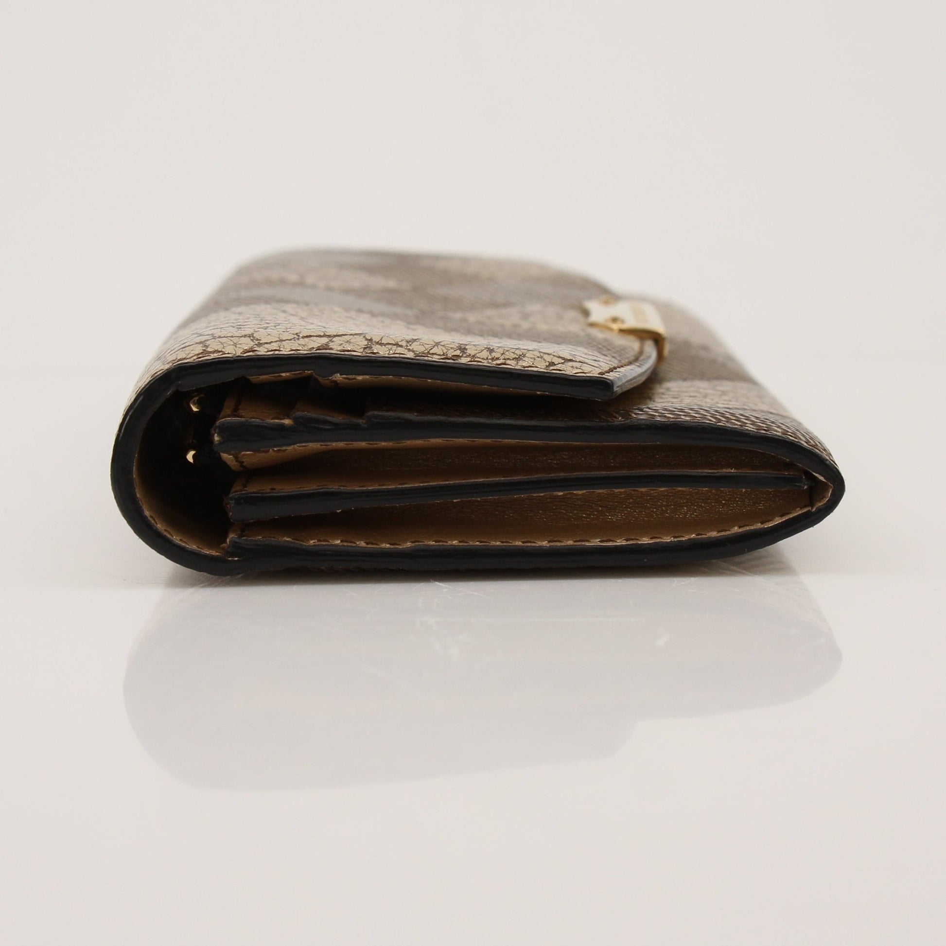 Gold & Beyond Burberry Continental Wallet showing brown leather exterior with gold-tone hardware and multiple card slots.