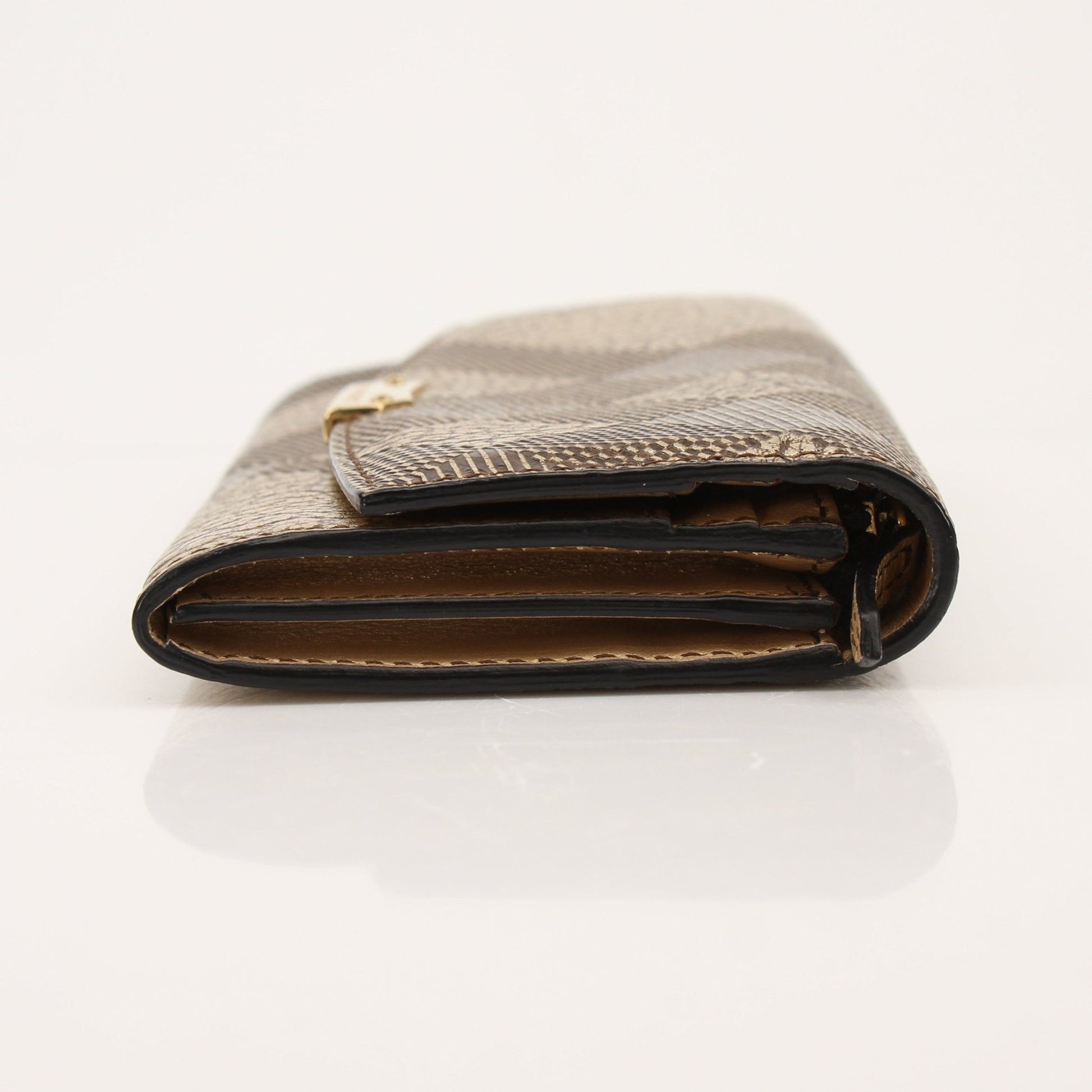 Gold & Beyond Burberry Continental Wallet showing its sleek leather design and multiple card slots.