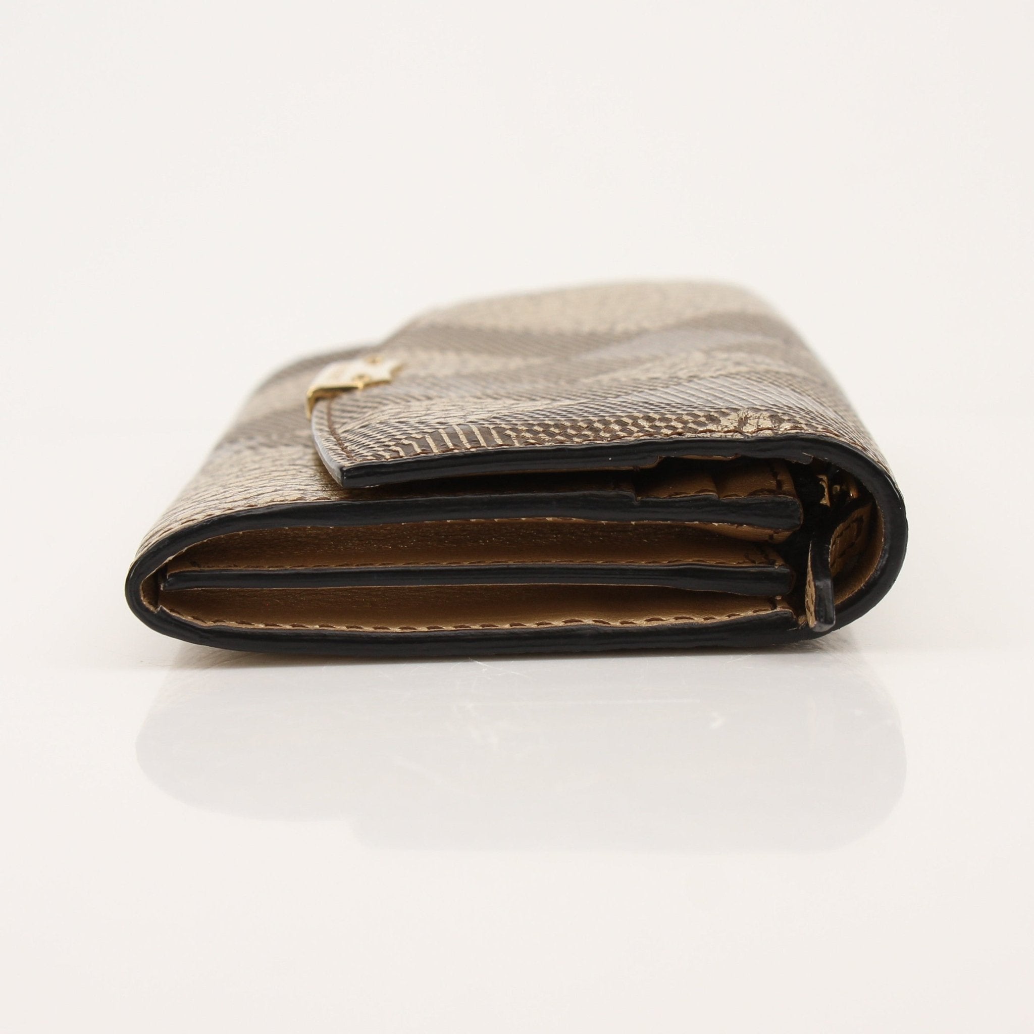 Gold & Beyond Burberry Continental Wallet showing its sleek leather design and multiple card slots.