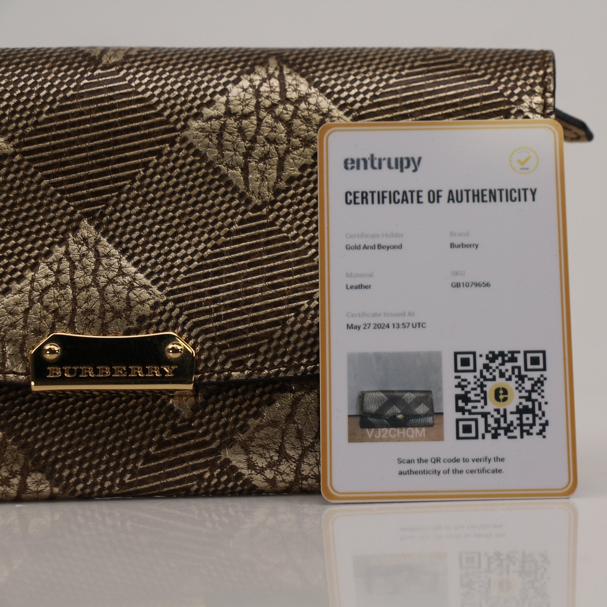 Gold & Beyond Burberry Continental Wallet, sleek leather wallet with multiple card slots and classic check pattern detail.