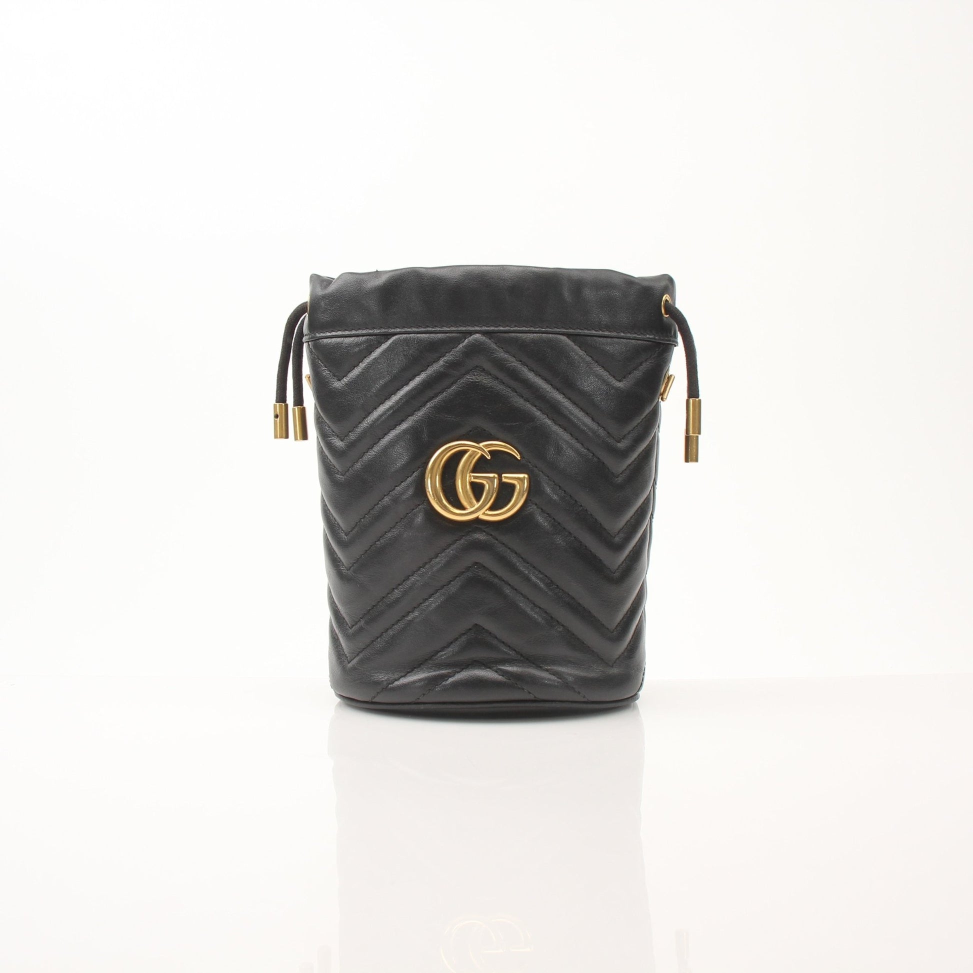 Gold & Beyond Gucci GG Marmont small bucket handbag with quilted leather and chain strap, stylish and compact for everyday use