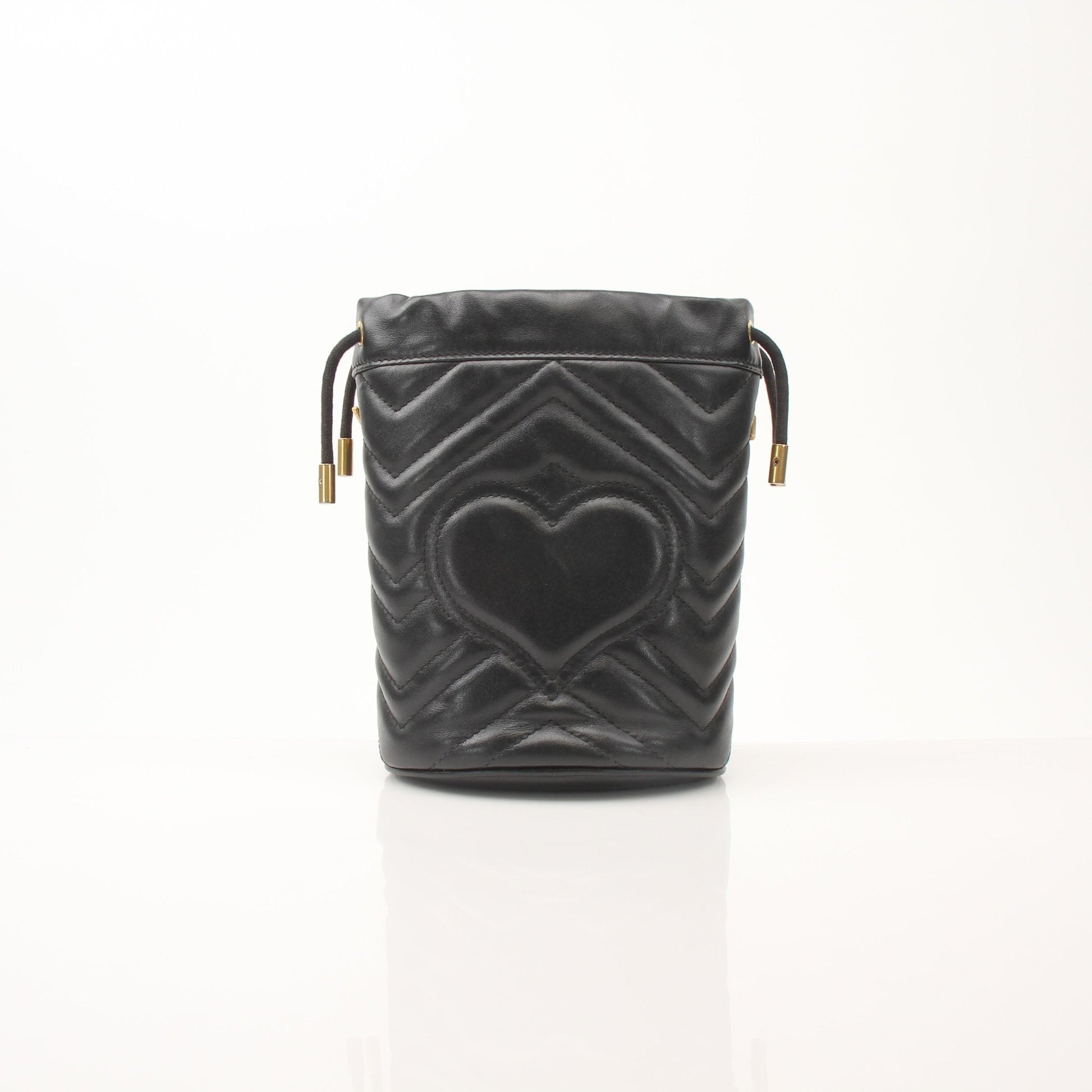 Gold & Beyond Gucci GG Marmont small bucket handbag with quilted leather and chain strap, stylish compact accessory.