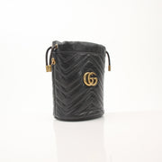 Gold & Beyond Gucci GG Marmont small bucket handbag with quilted leather and gold hardware, stylish and compact for everyday use.