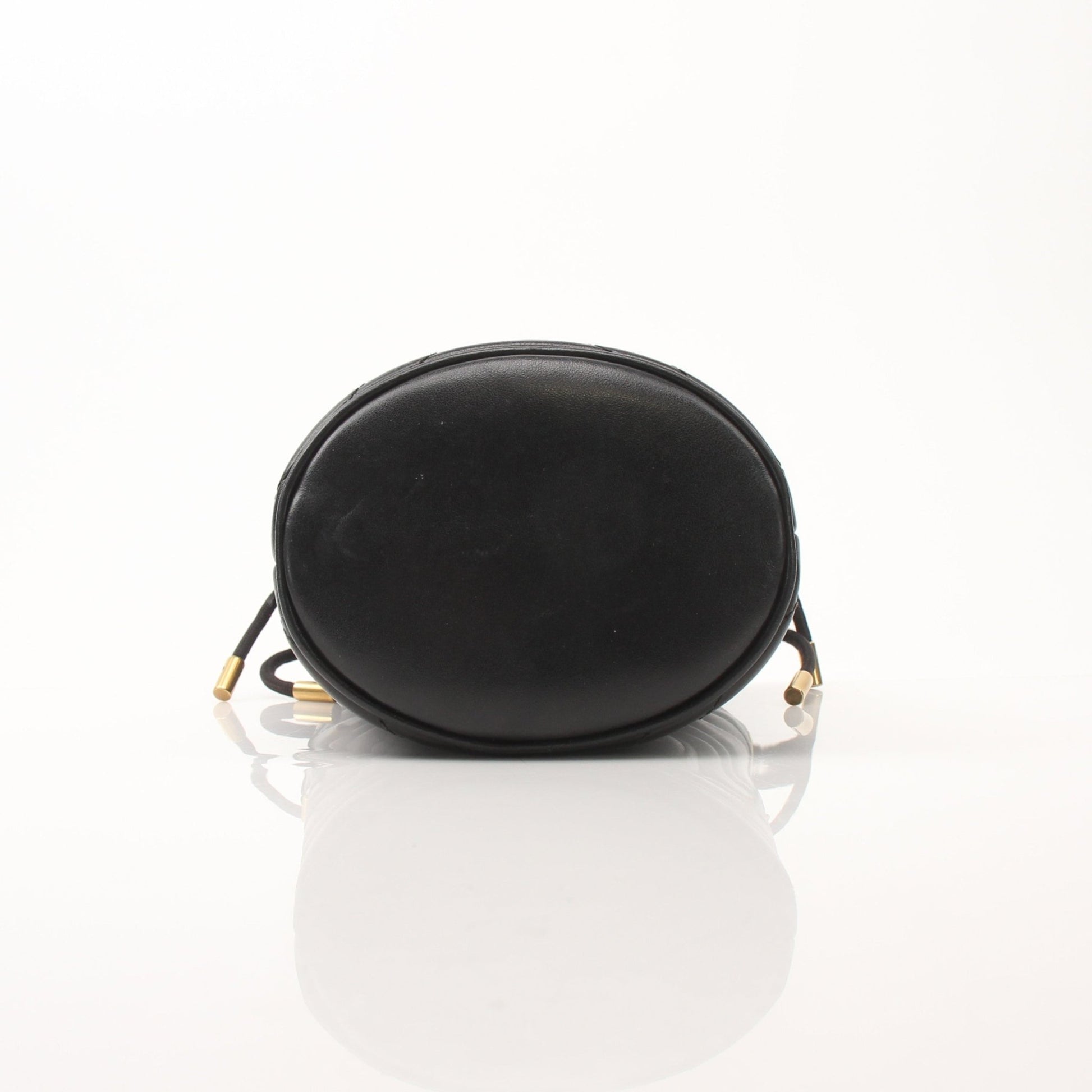 Gold & Beyond Gucci GG Marmont small bucket handbag with quilted leather and chain strap, shown from front view.