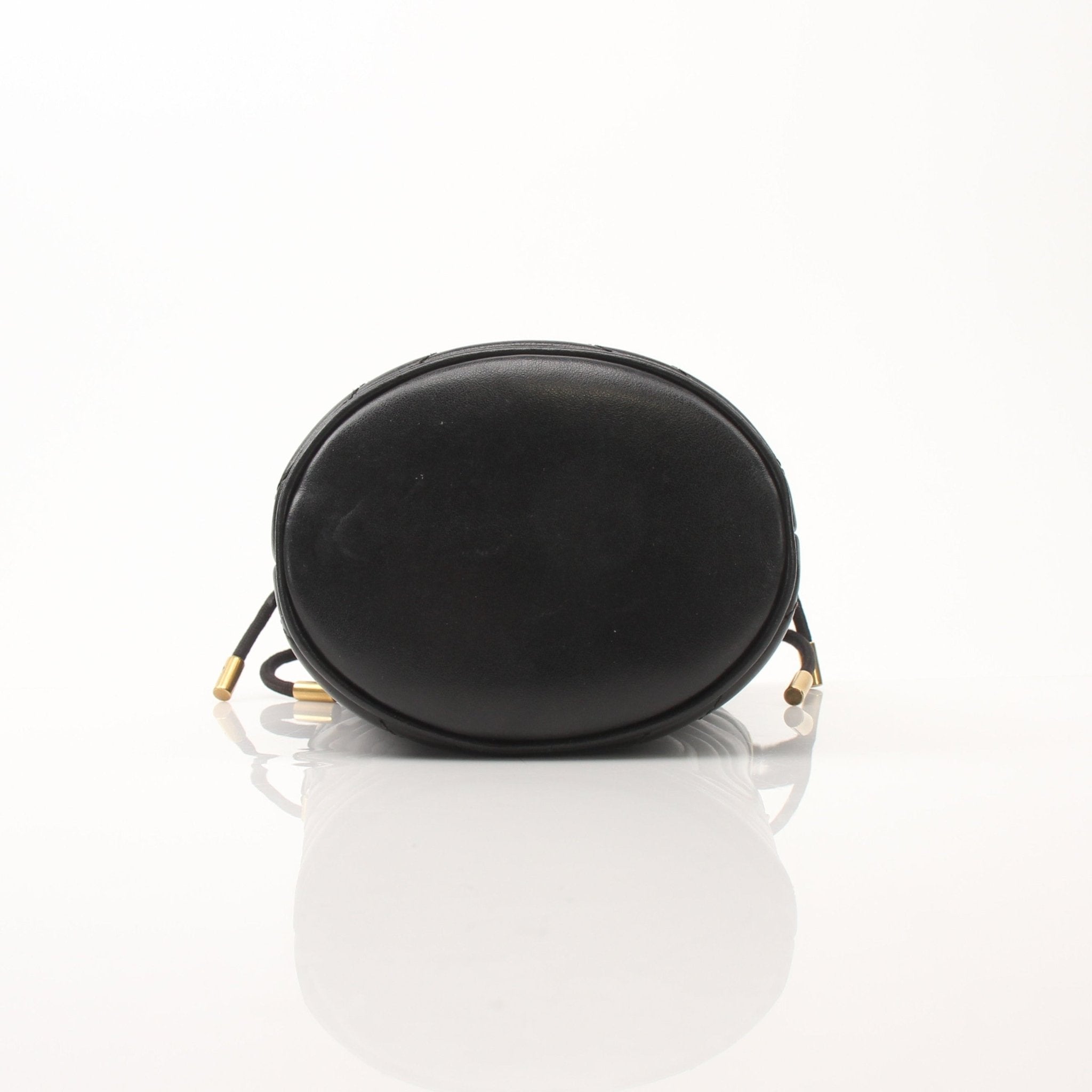 Gold & Beyond Gucci GG Marmont small bucket handbag with quilted leather and chain strap, shown from front view.