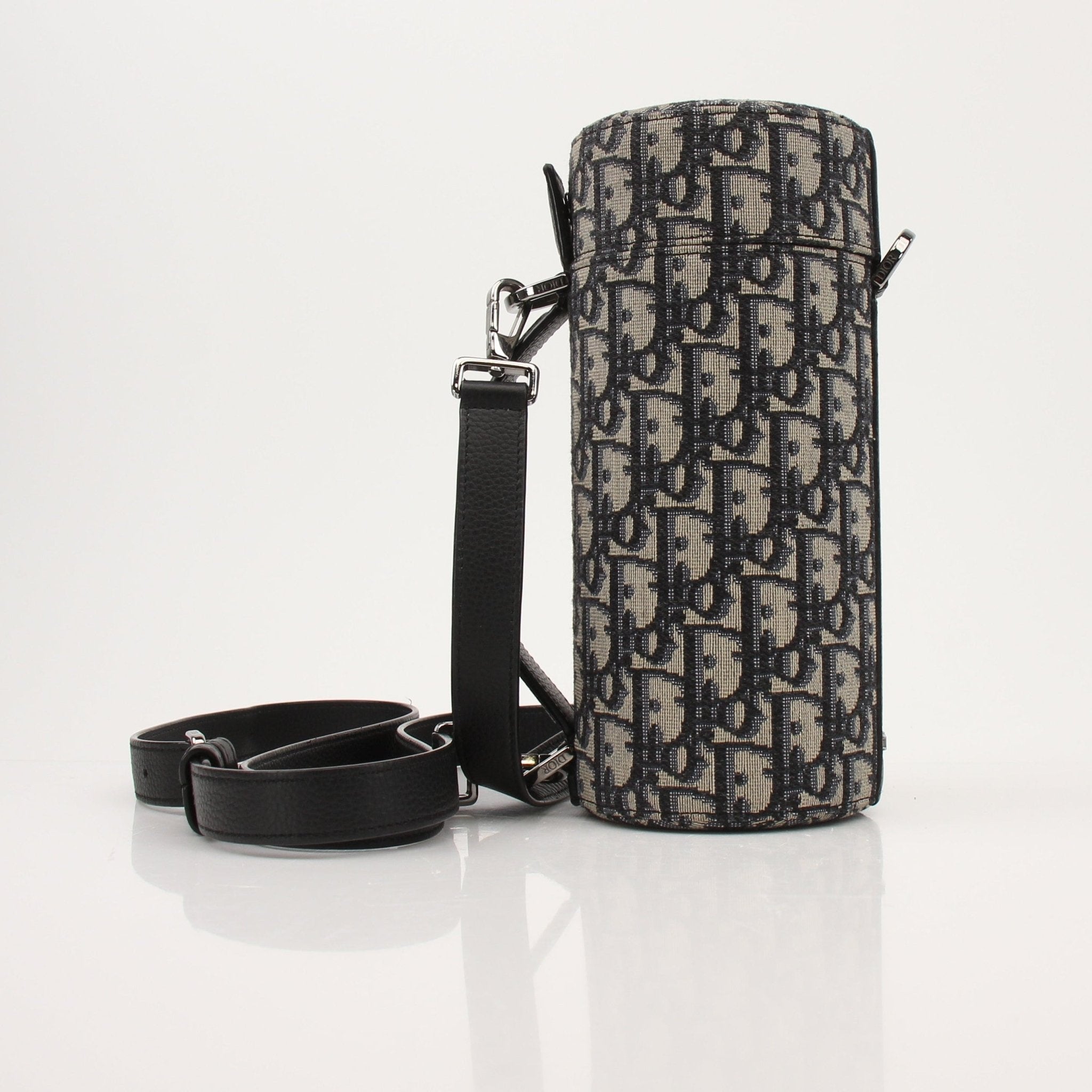 Christian Dior Oblique Vertical Crossbody handbag with gold accents, showcasing the iconic pattern and sleek design.