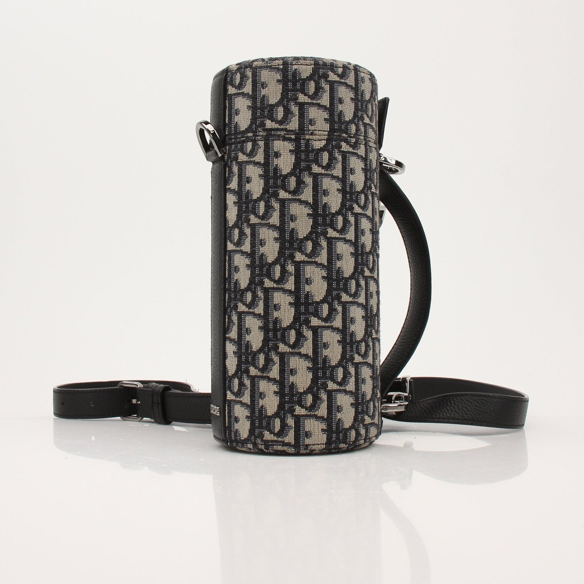 Christian Dior Oblique vertical crossbody handbag with gold accents, featuring signature Dior monogram pattern and sleek design.