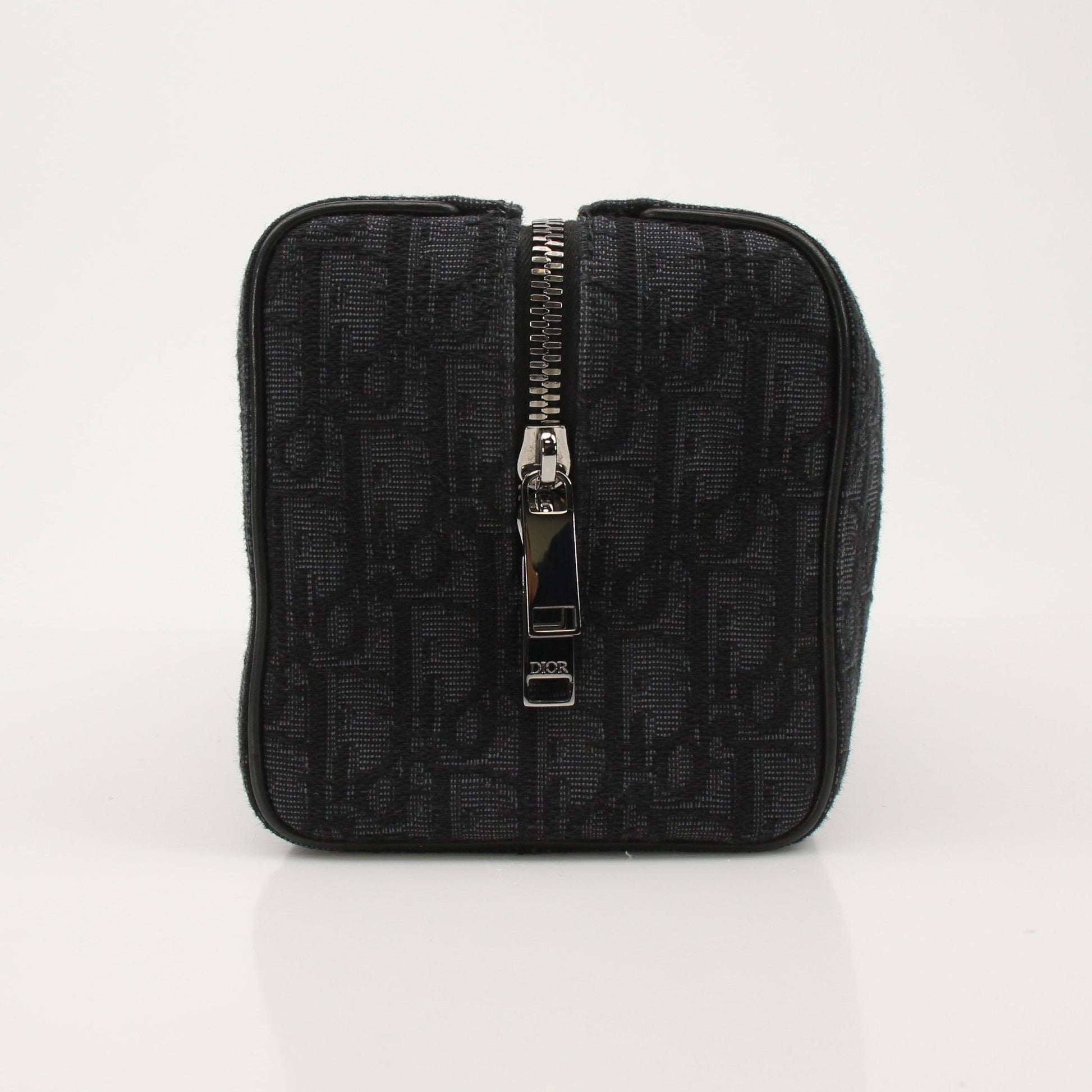 Christian Dior Dior Oblique toiletry bag by Gold & Beyond, featuring classic Dior monogram pattern and compact handbag design.