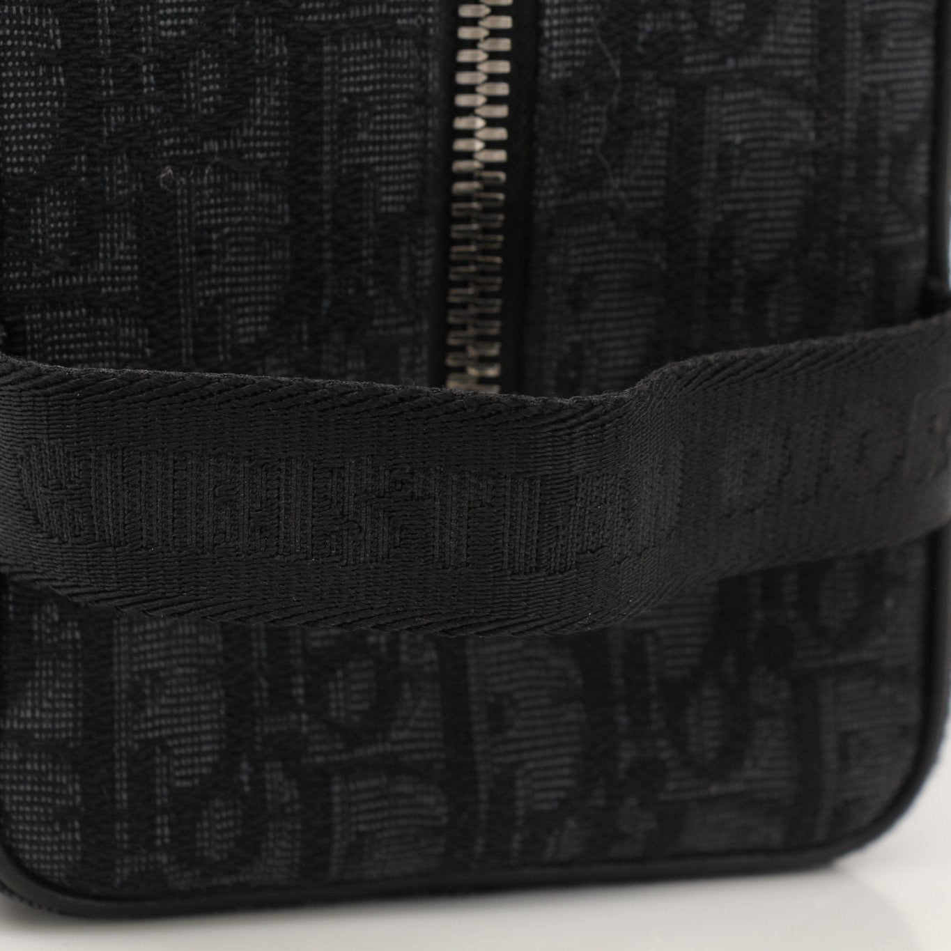 Christian Dior Dior Oblique toiletry bag with gold accents, featuring the signature monogram pattern and compact handbag design.