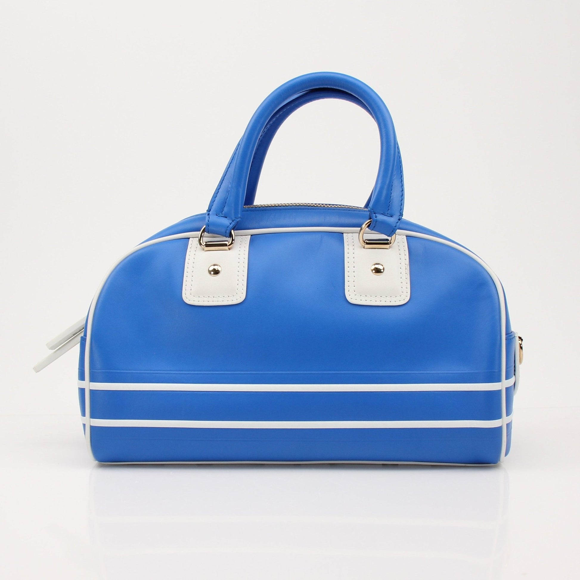 Christian Dior blue bowling handbag with gold accents, showcasing a stylish and luxurious designer purse in a close-up shot.