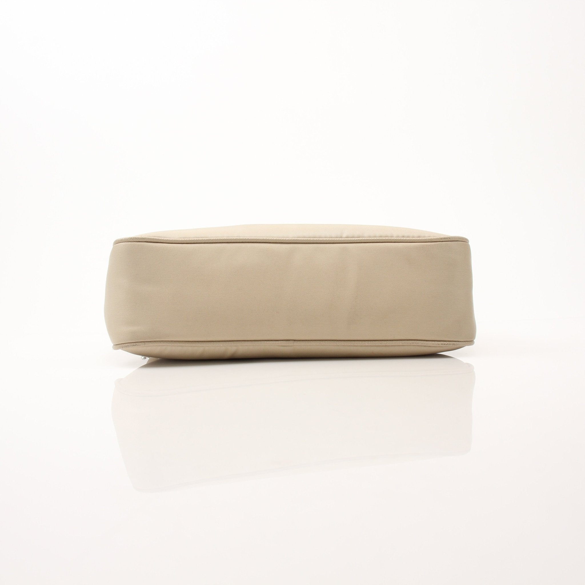 Prada Re-Edition 2005 Re-Nylon shoulder handbag with sleek design and adjustable strap, displayed on a white background.