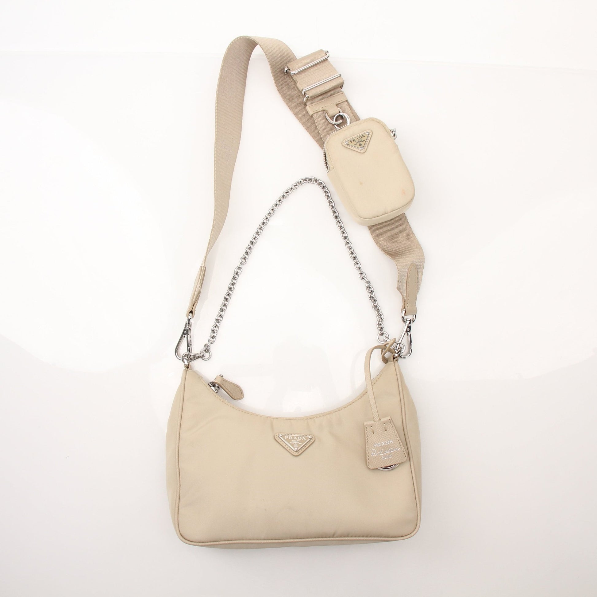 Prada Re-Edition 2005 Re-Nylon shoulder handbag with sleek design and gold-tone hardware, displayed on a plain background.