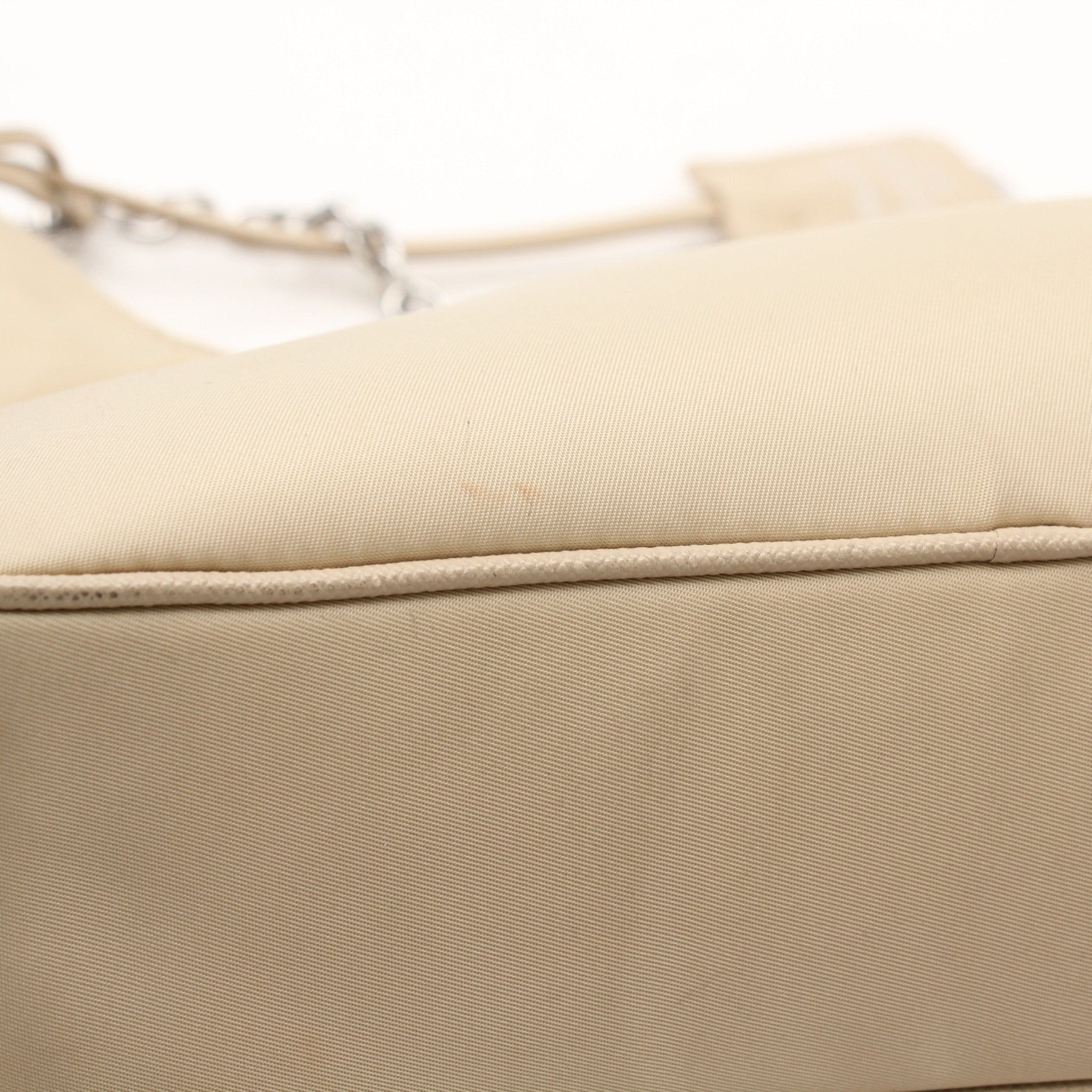 Prada Re-Edition 2005 Re-Nylon shoulder handbag with logo detail, featuring a sleek design and adjustable strap.