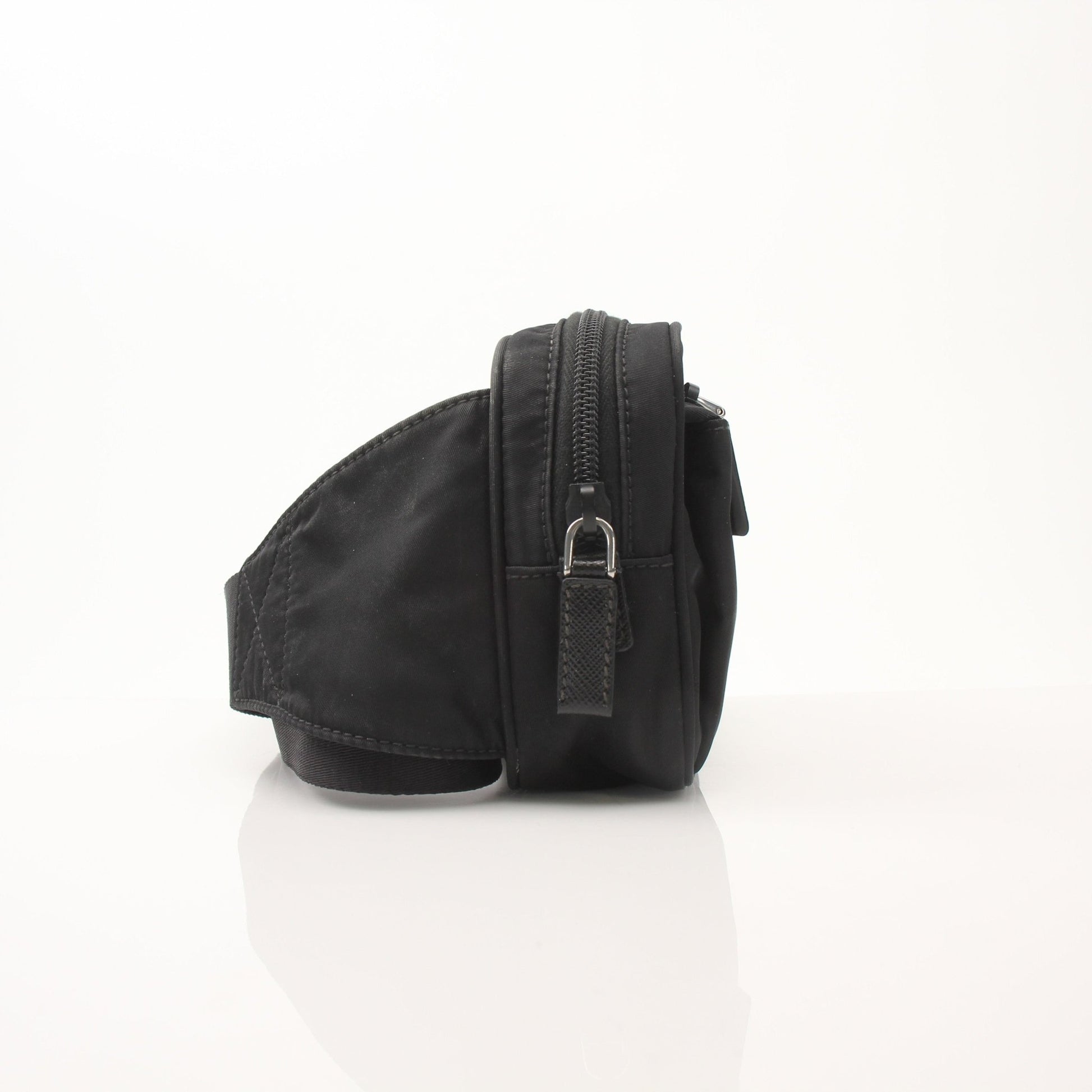 Gold & Beyond Prada Re-Nylon belt bag handbag with adjustable strap and sleek design, shown in the product image.
