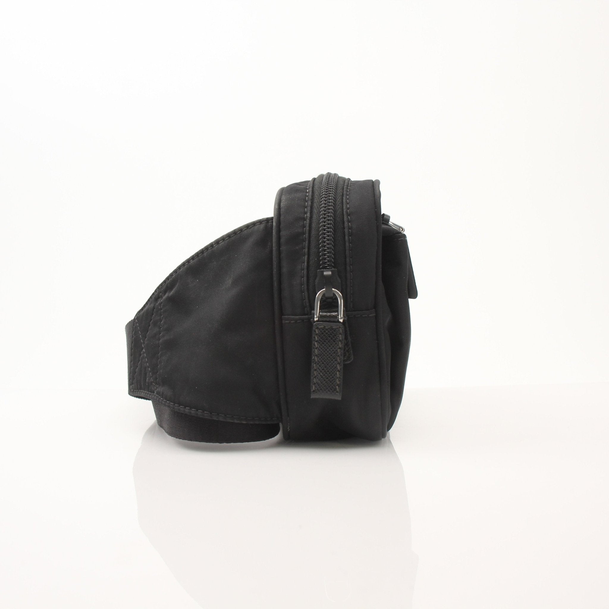 Gold & Beyond Prada Re-Nylon belt bag handbag with adjustable strap and sleek design, shown in the product image.