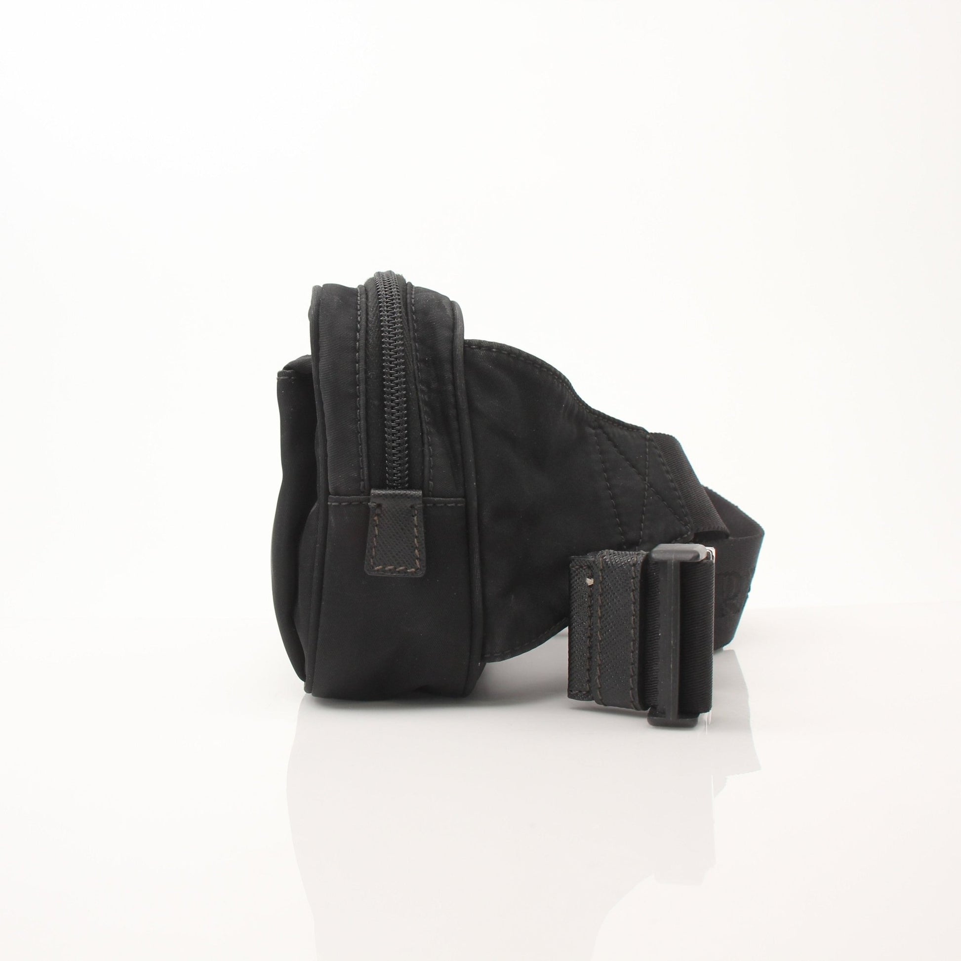 Prada Re-Nylon belt bag by Gold & Beyond, stylish handbag featuring sleek design and adjustable strap, made from eco-friendly nylon.