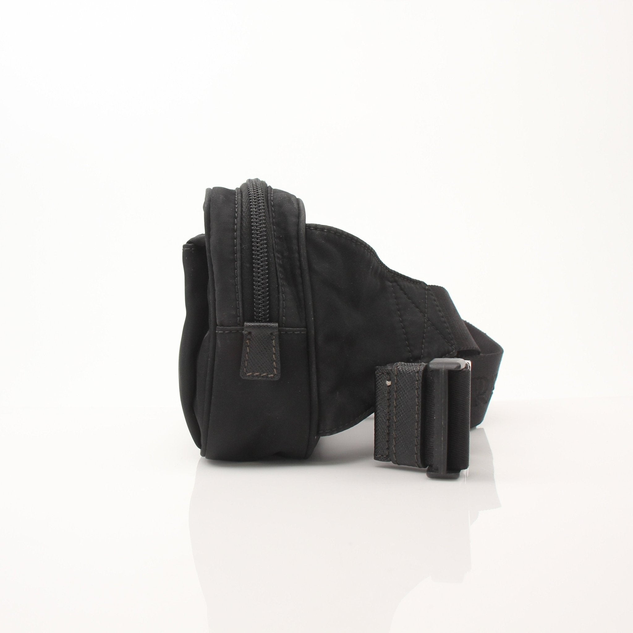 Prada Re-Nylon belt bag by Gold & Beyond, stylish handbag featuring sleek design and adjustable strap, made from eco-friendly nylon.