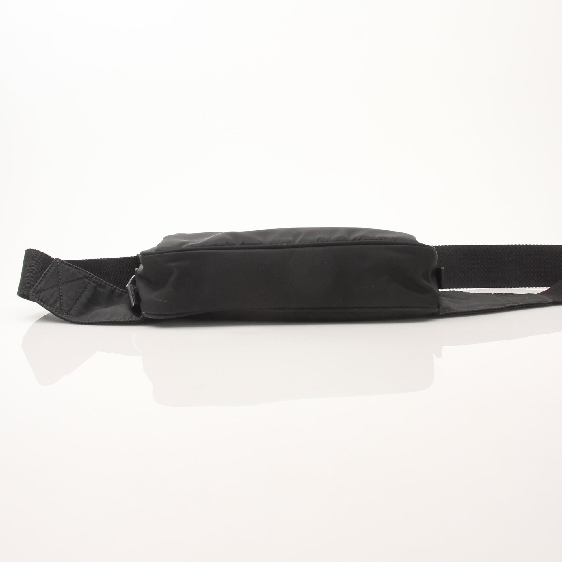 Prada Re-Nylon Belt Bag handbag with adjustable strap and sleek design, featuring the Prada logo and modern eco-friendly style.