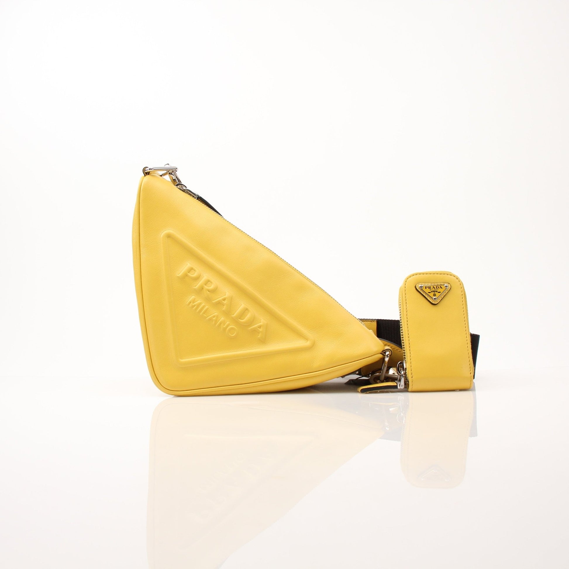 Prada Grace Lux triangle leather shoulder handbag with gold hardware and adjustable strap, featuring a sleek, elegant design.