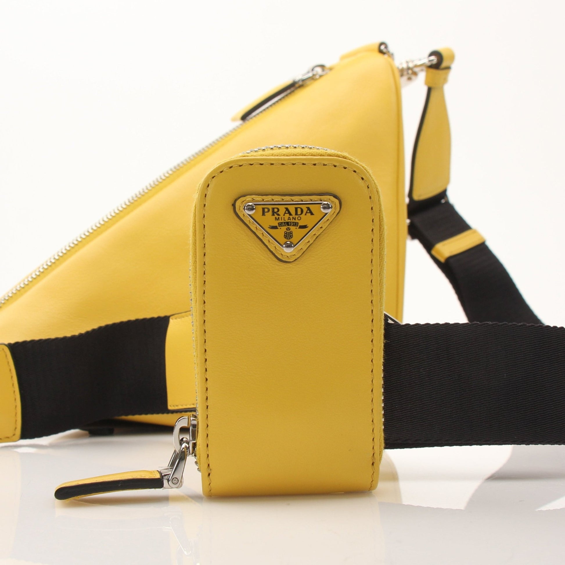 Prada Grace Lux Triangle Leather Shoulder Bag, elegant handbag with gold hardware and structured design, in black leather.