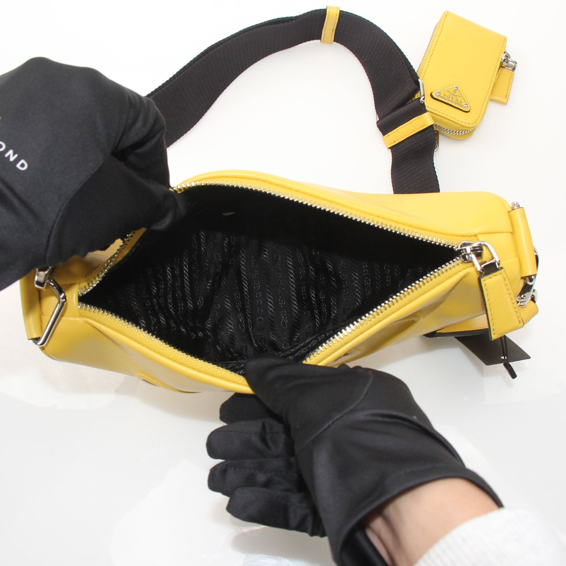 Prada Grace Lux Triangle Leather Shoulder Bag with gold hardware, featuring a sleek design and premium leather finish.