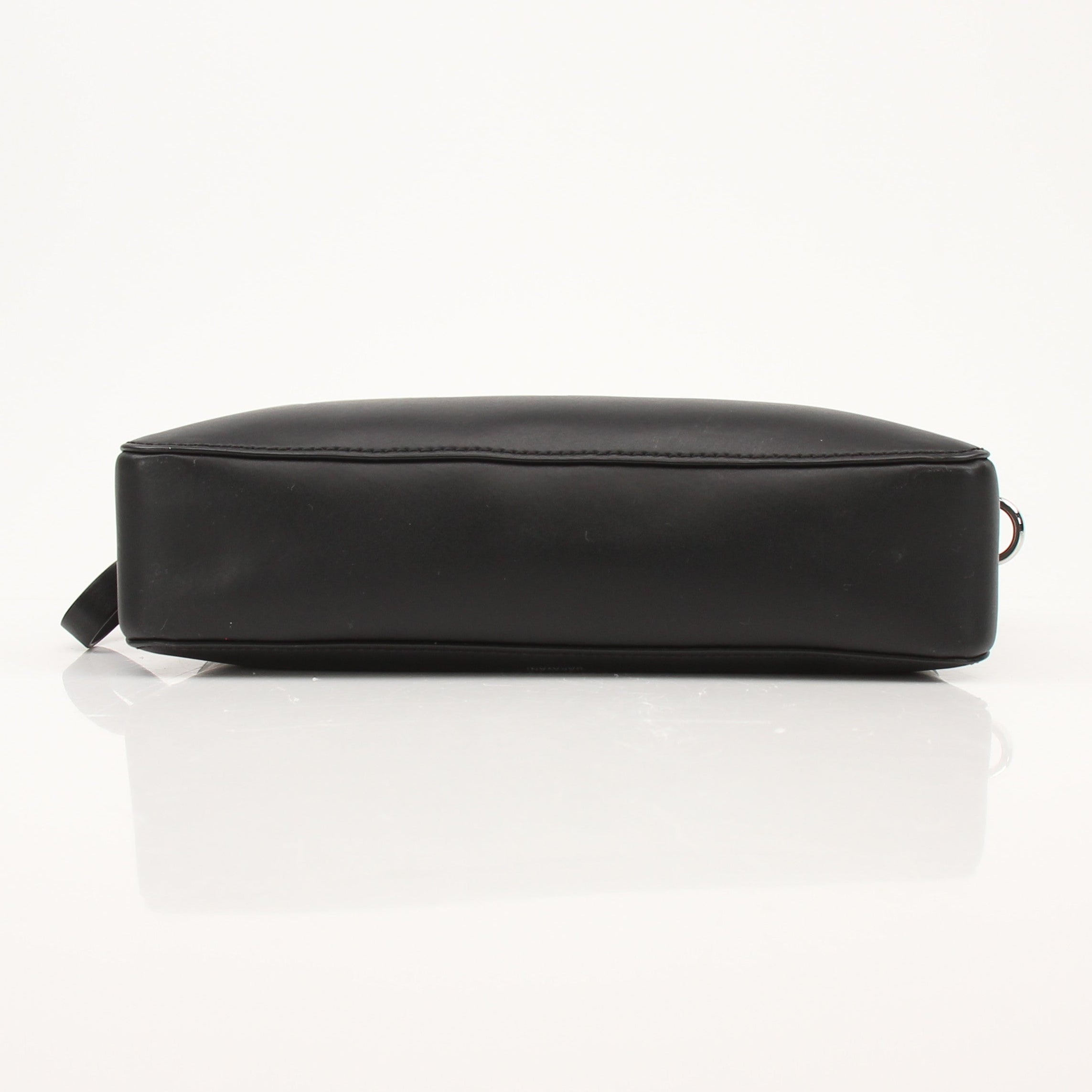 Black Valentino crossbody handbag by Gold & Beyond with sleek design and adjustable strap, featuring a minimalist style.