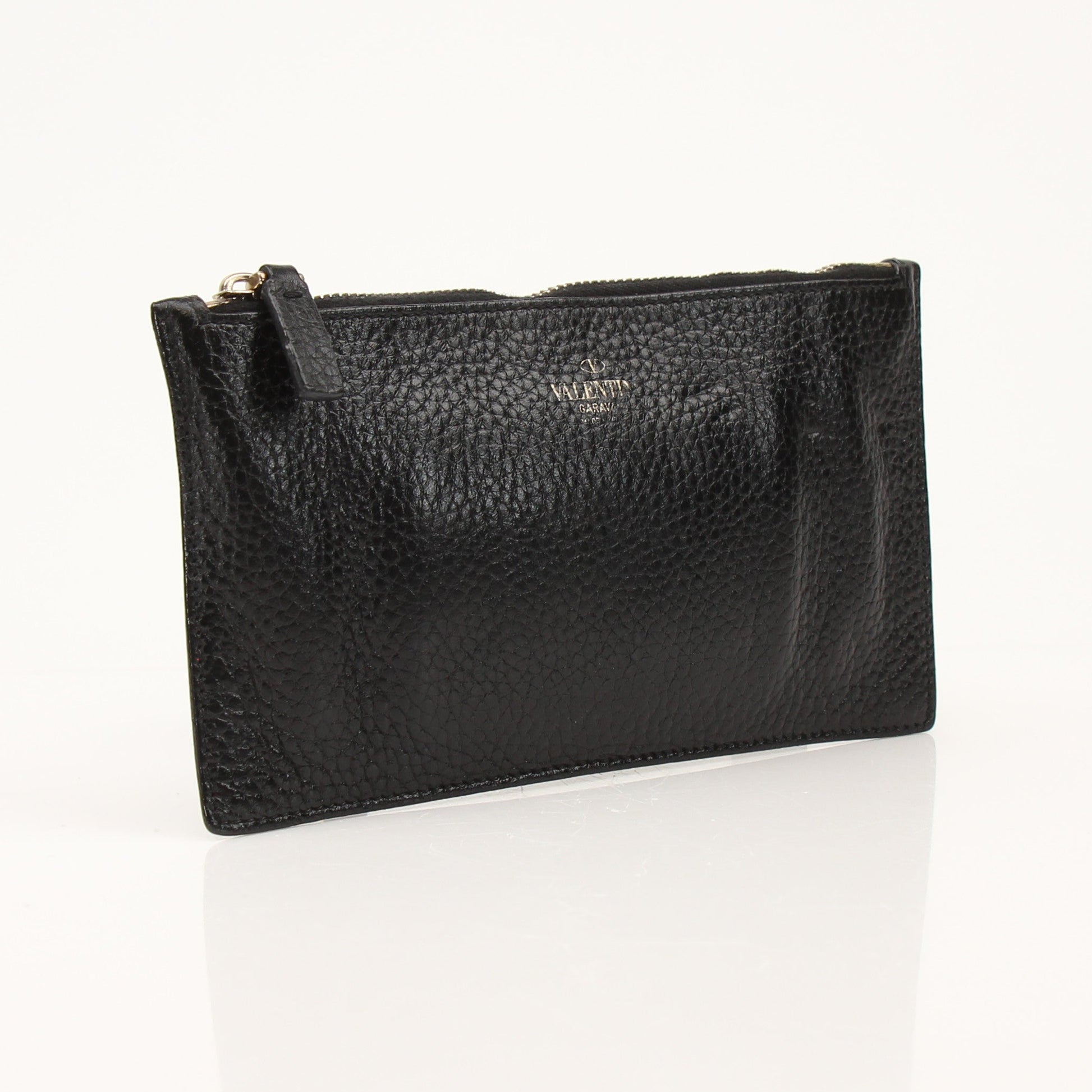 Gold & Beyond Valentino Rockstud Spike wallet with metallic accents and signature stud detailing on black leather.