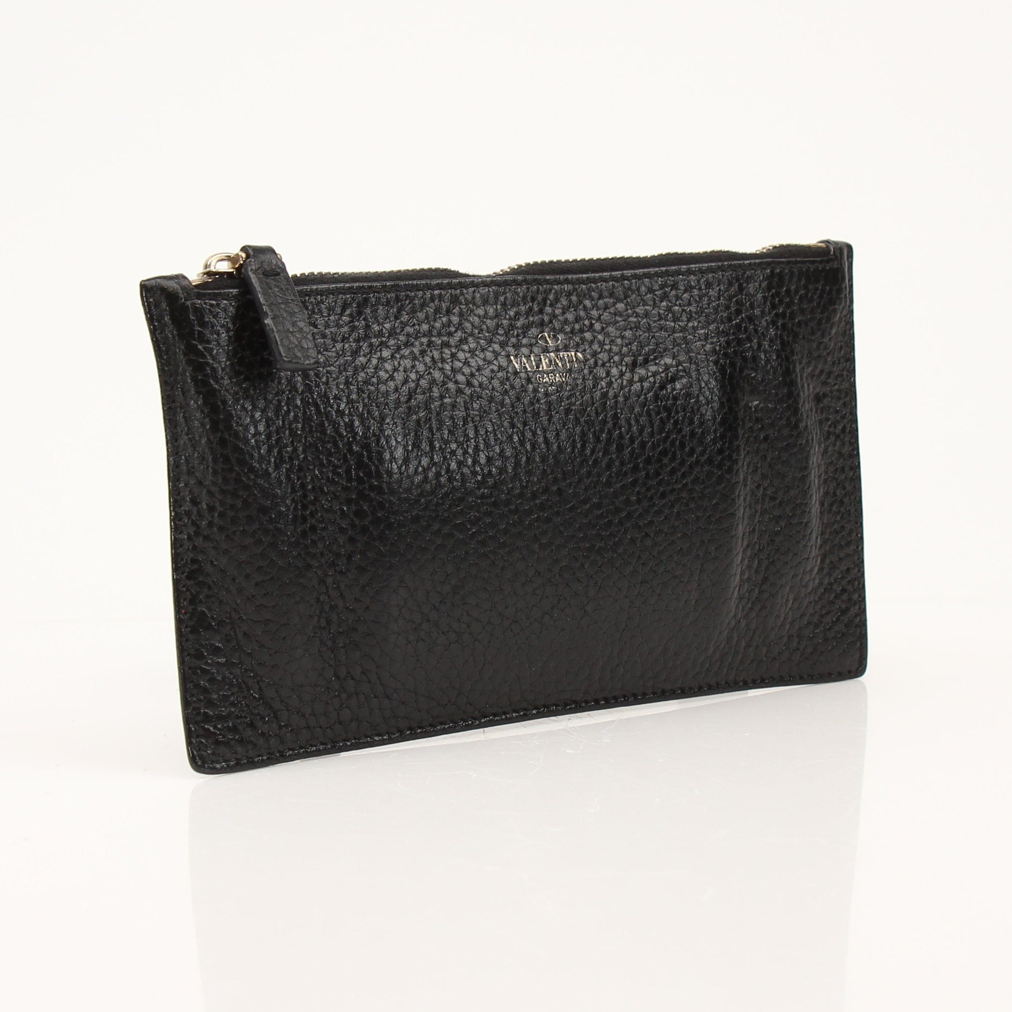 Gold & Beyond Valentino Rockstud Spike wallet with metallic accents and signature stud detailing on black leather.