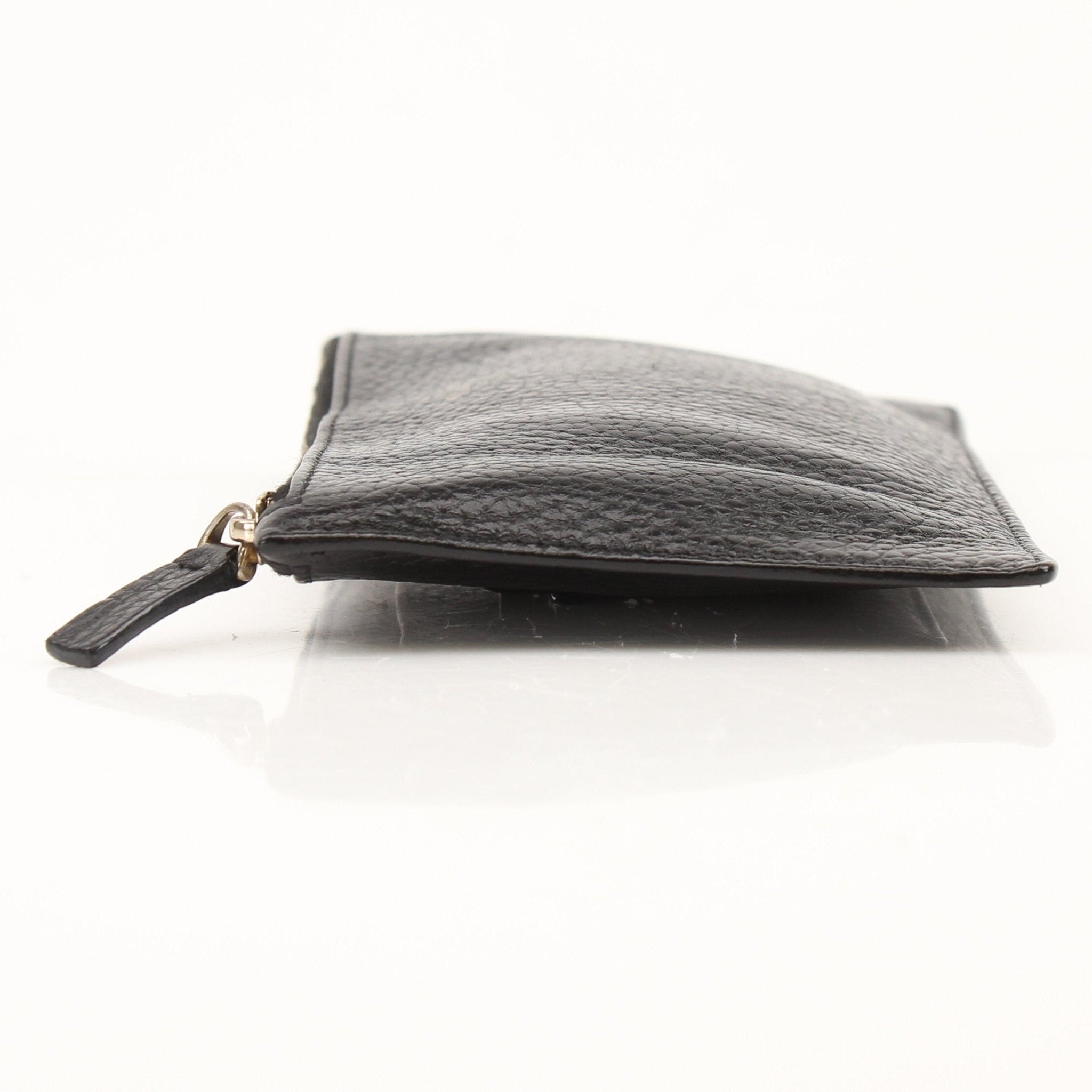 Gold & Beyond Valentino Rockstud Spike Wallet with studded leather design and compact shape, showcasing its luxury style.