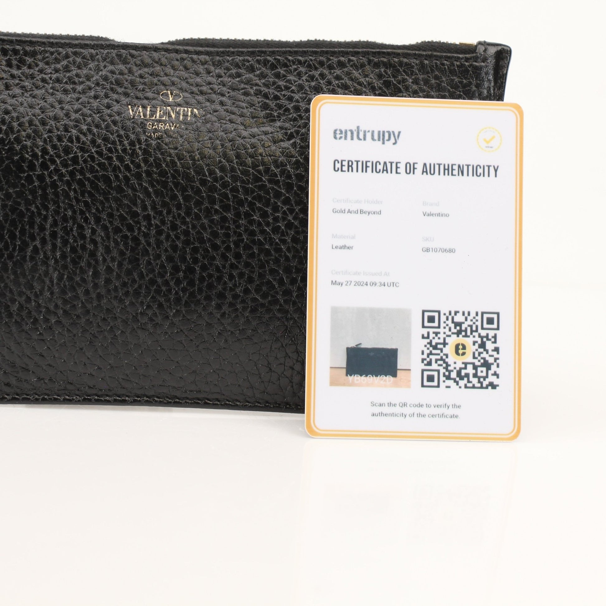 Gold & Beyond Valentino Rockstud Spike Wallet with studded design and zip-around closure, featuring a black leather finish.