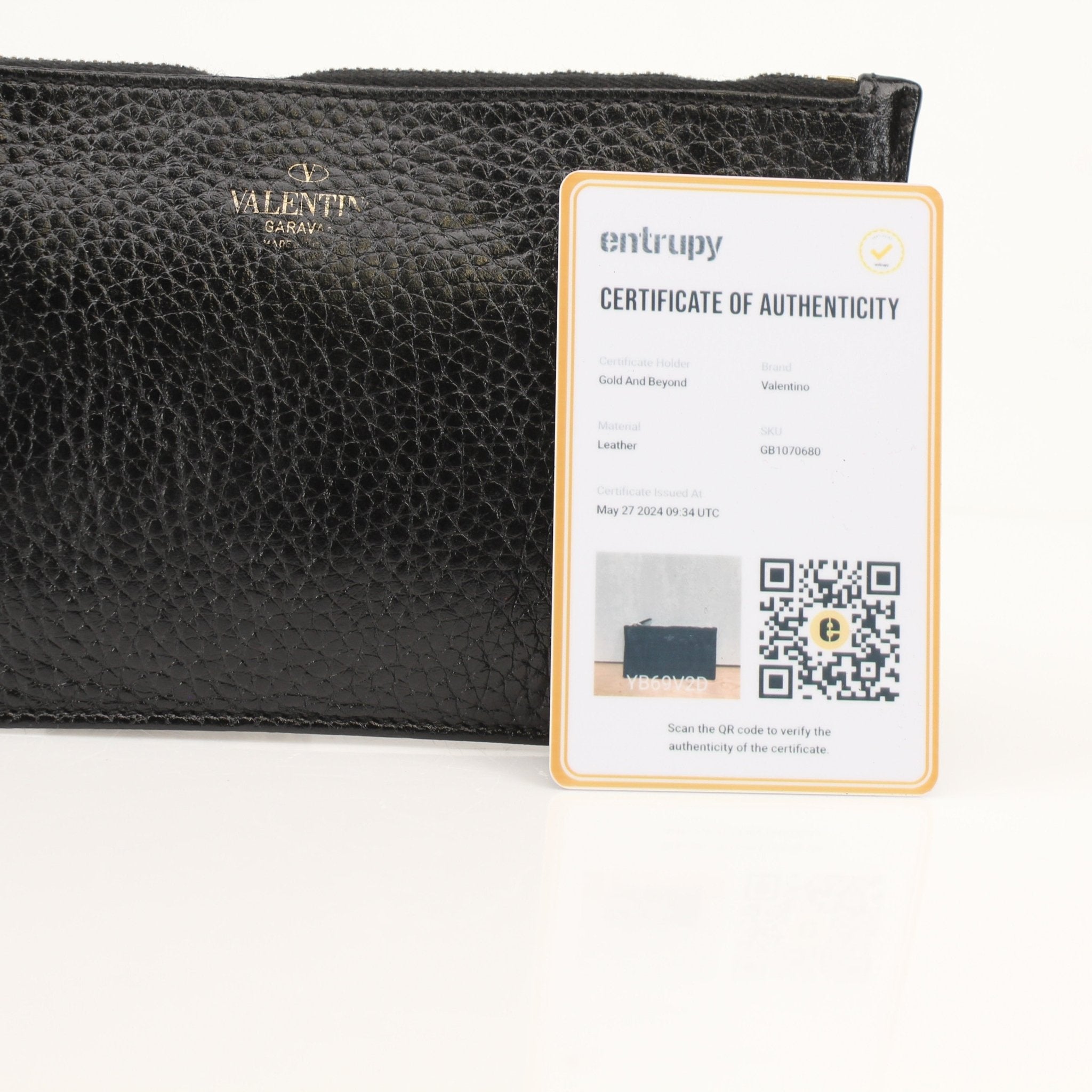 Gold & Beyond Valentino Rockstud Spike Wallet with studded design and zip-around closure, featuring a black leather finish.