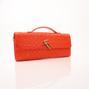 Gold Bottega Veneta Andiamo clutch handbag with sleek design and gold-tone accents, displayed on a neutral background.