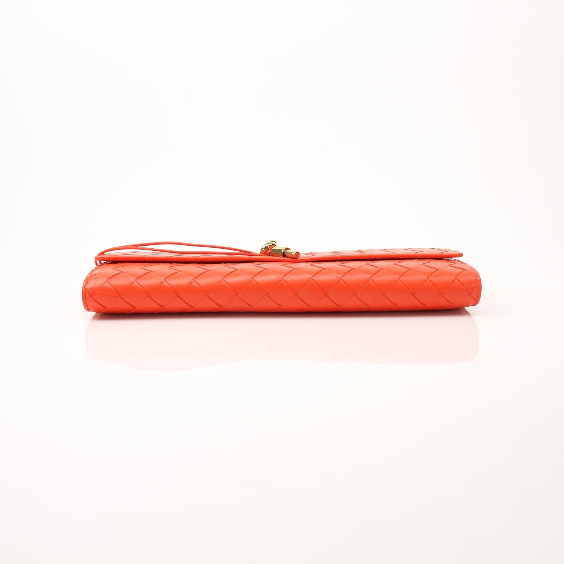 Gold & Beyond Bottega Veneta Andiamo clutch handbag with woven leather design and gold-tone hardware.