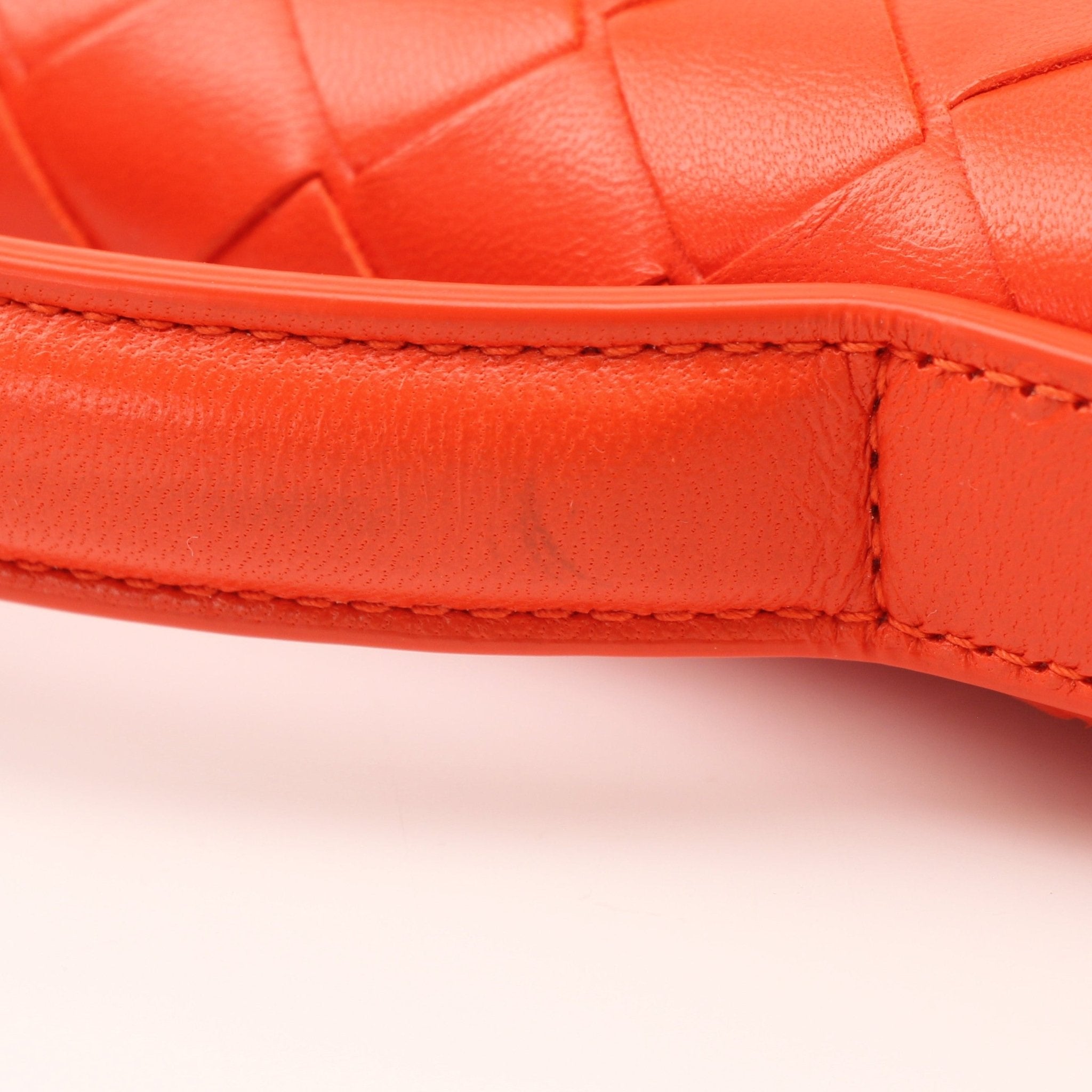 Gold & Beyond Bottega Veneta Andiamo clutch handbag with textured leather and elegant design, featuring a zipper closure.
