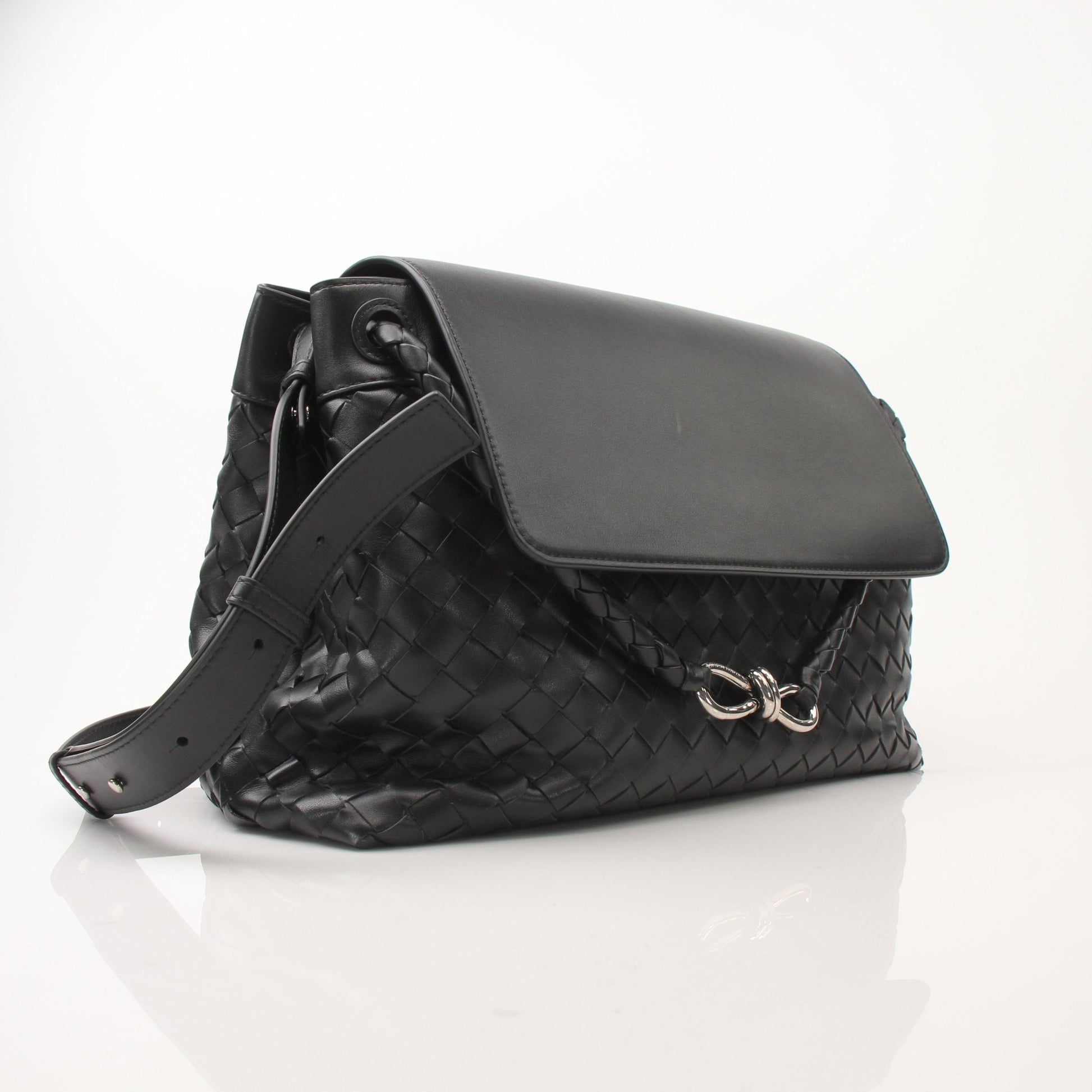 Gold and Beyond Bottega Veneta Andiamo Messenger handbag with tan leather, adjustable strap, and subtle woven design.