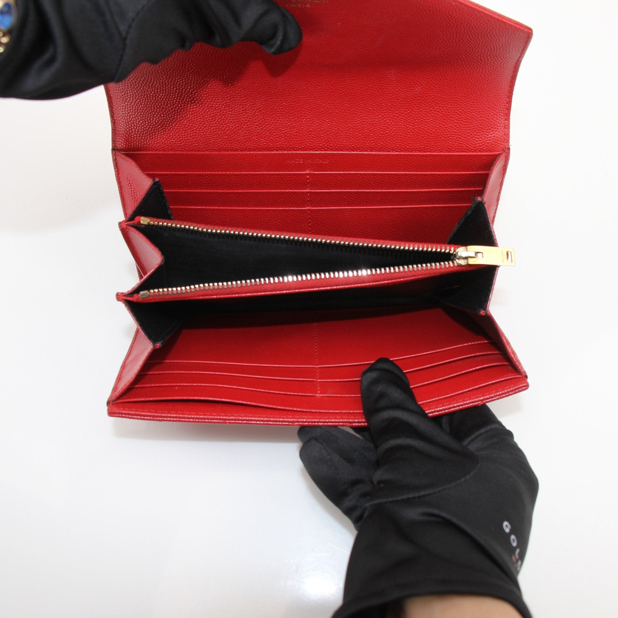 Gold & Beyond Saint Laurent red envelope chain wallet with flap, featuring a sleek design and gold chain strap.