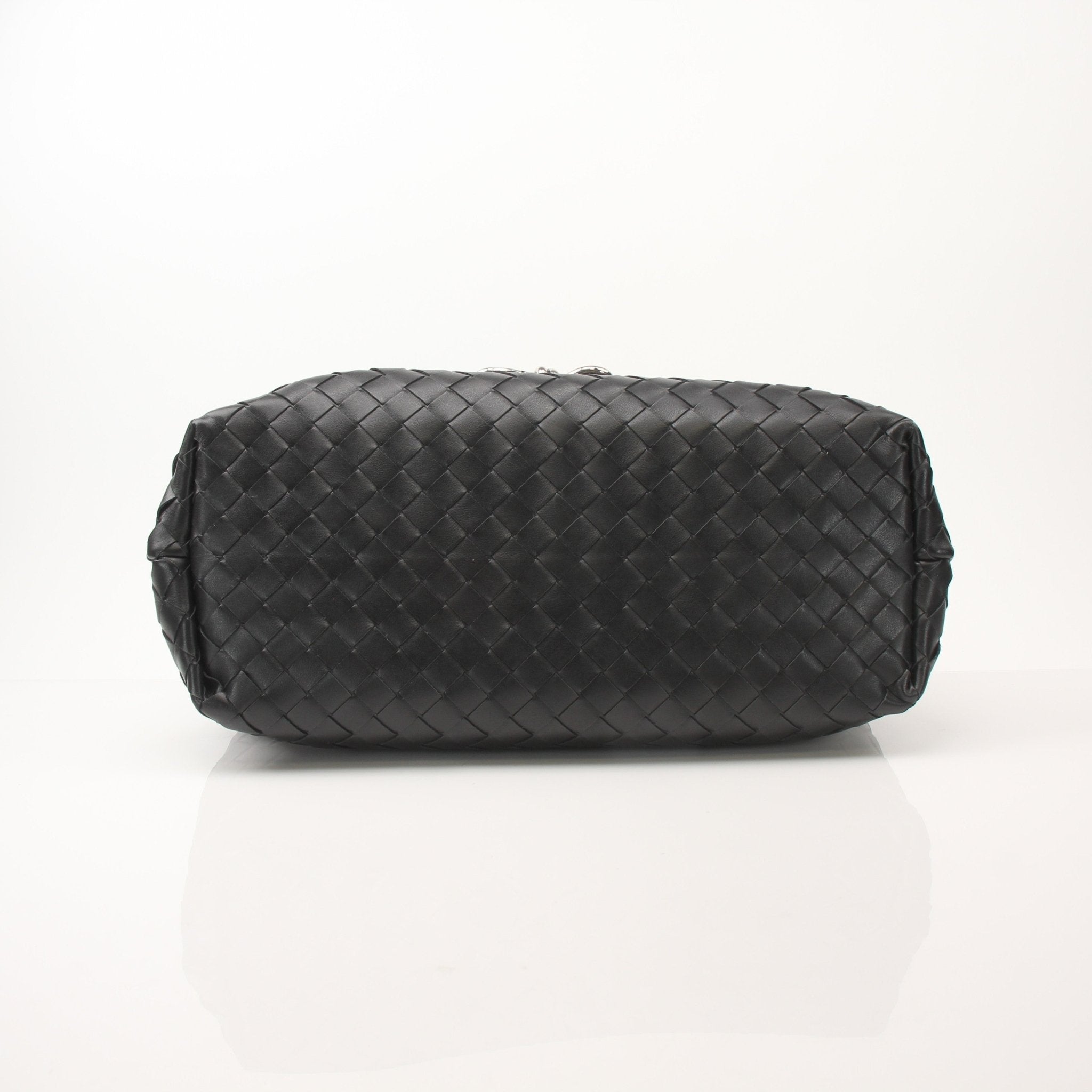 Gold and Beyond Bottega Veneta Andiamo Messenger handbag with leather strap and woven design, shown in natural lighting.