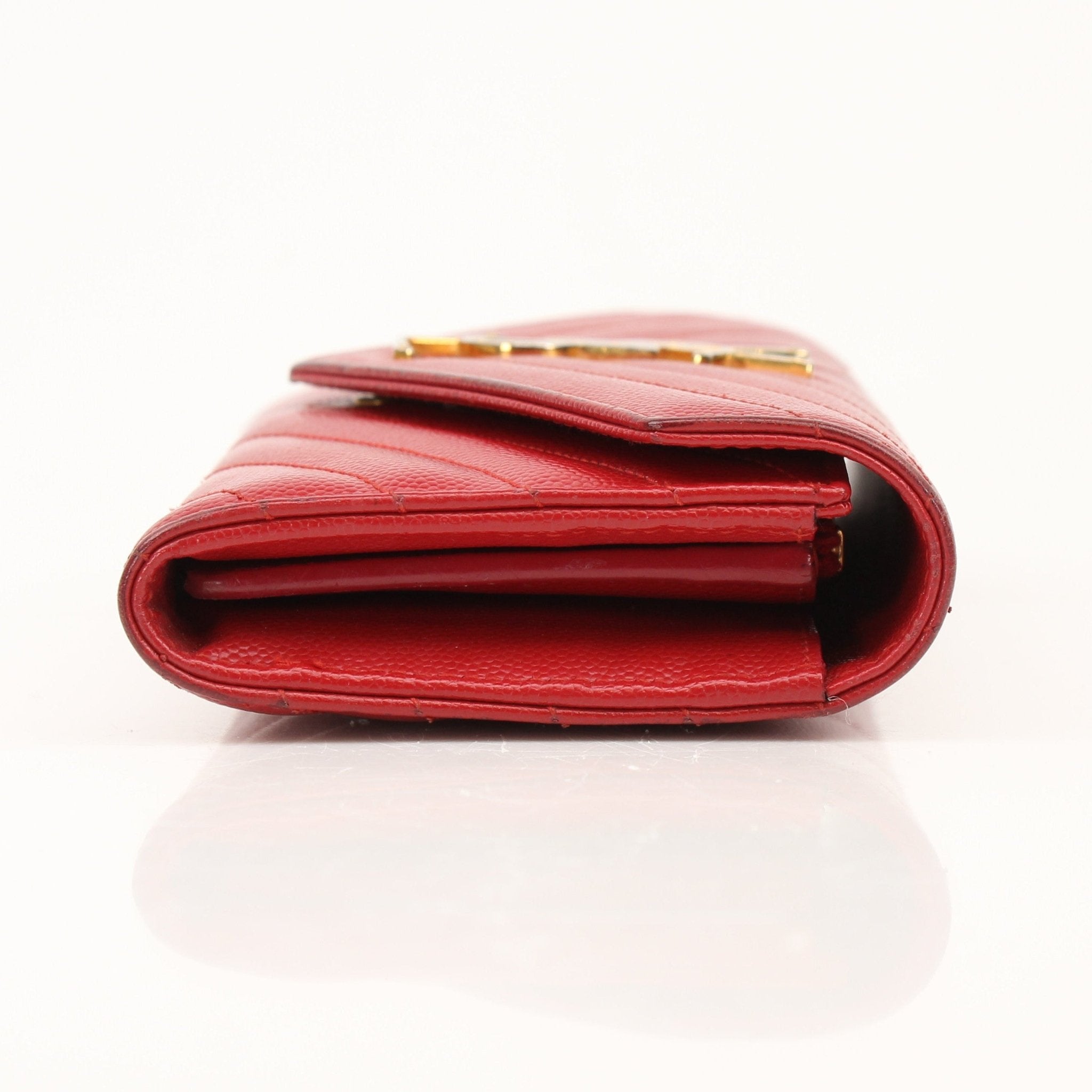 Gold & Beyond Saint Laurent red envelope chain wallet with flap, featuring a sleek compact design and gold-tone chain strap.