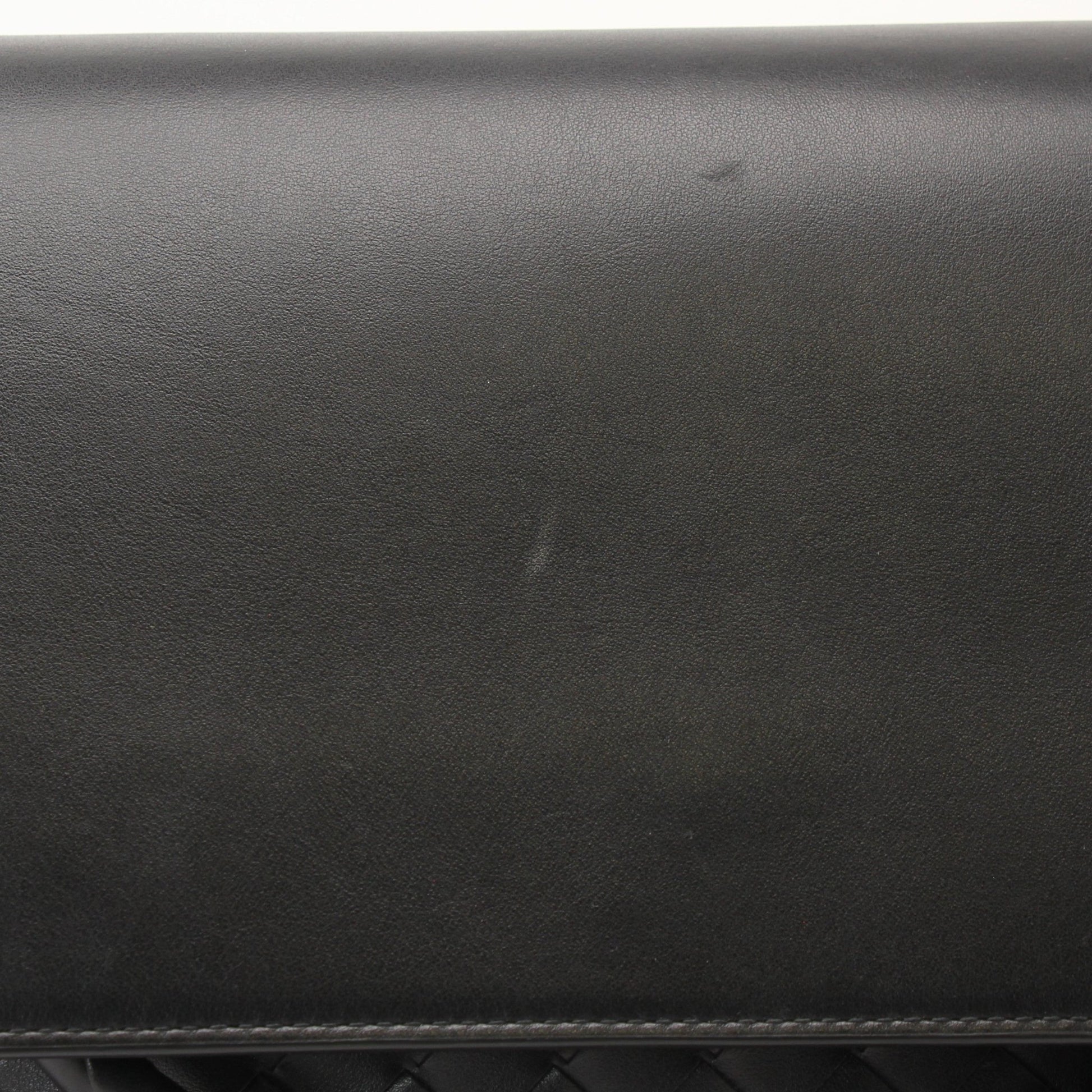 Gold & Beyond Bottega Veneta Andiamo Messenger handbag with leather strap and woven design, shown in a close-up view.