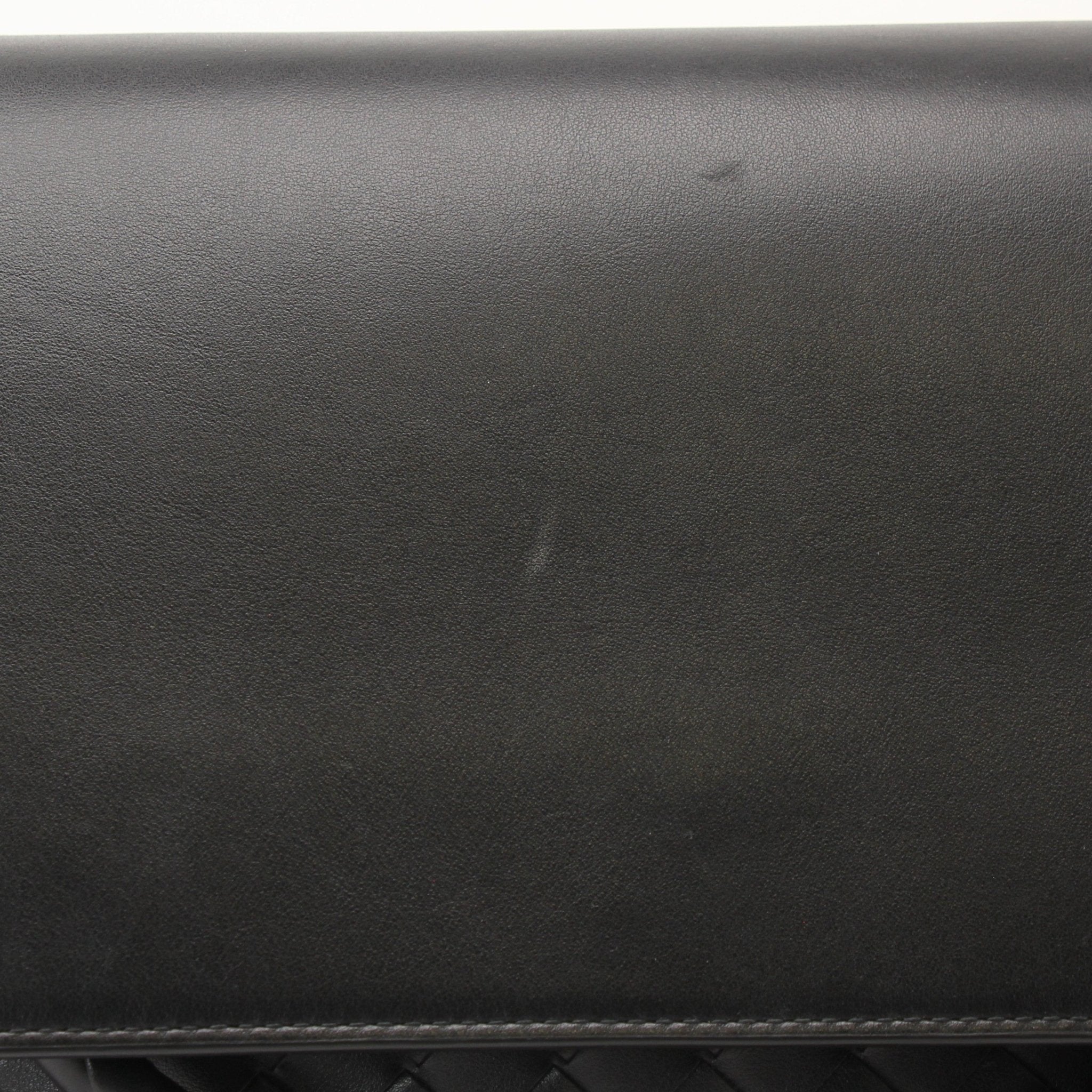 Gold & Beyond Bottega Veneta Andiamo Messenger handbag with leather strap and woven design, shown in a close-up view.